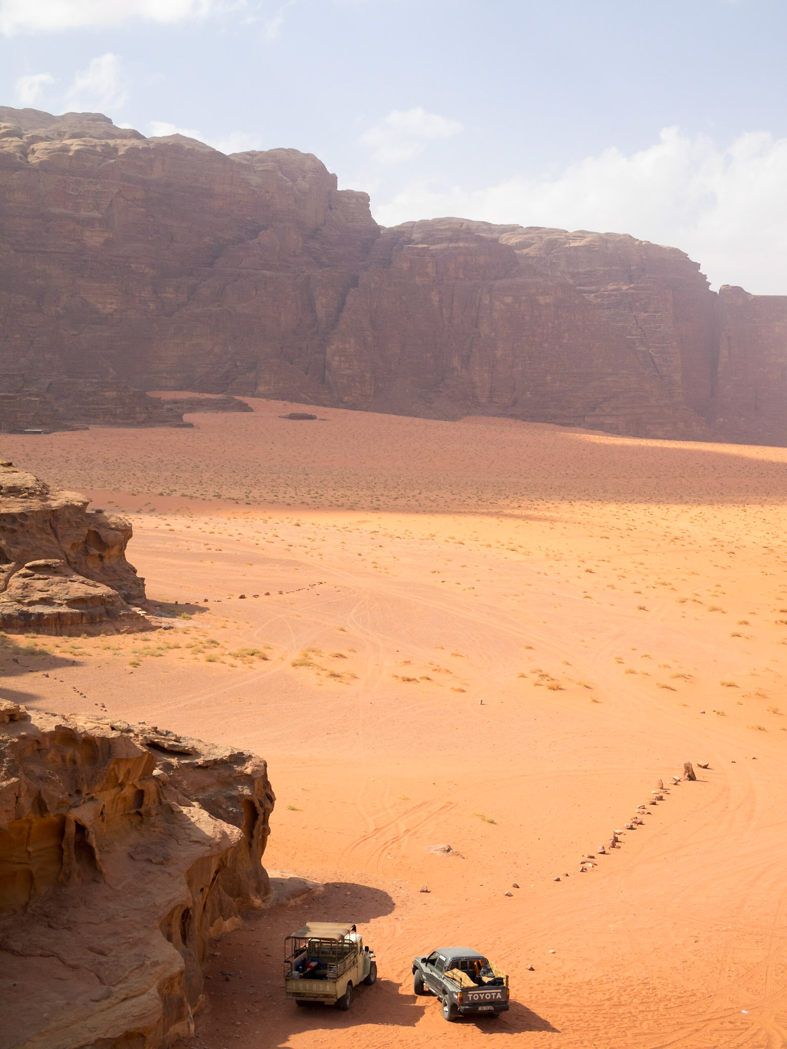 Jeep cars in Wadi Rum desert landscape