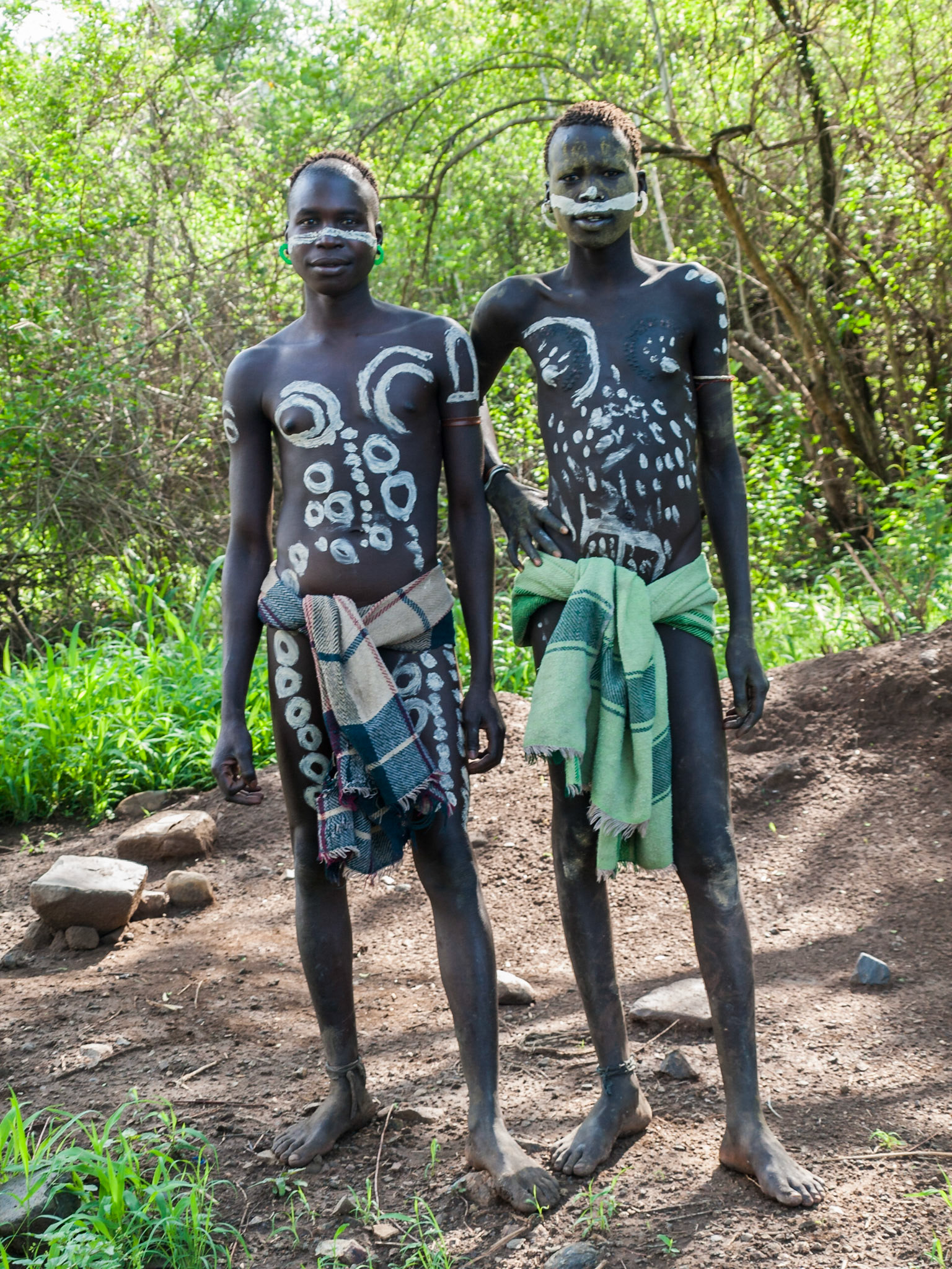 Mursi young men with painted bodies