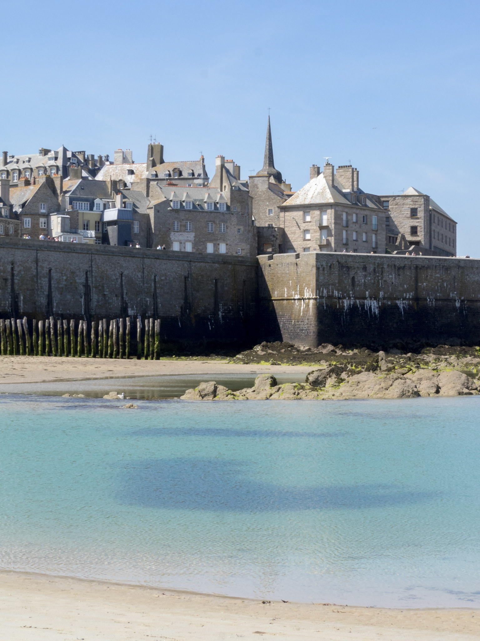 Low tide turquoise waters below Saint-Malo walled city