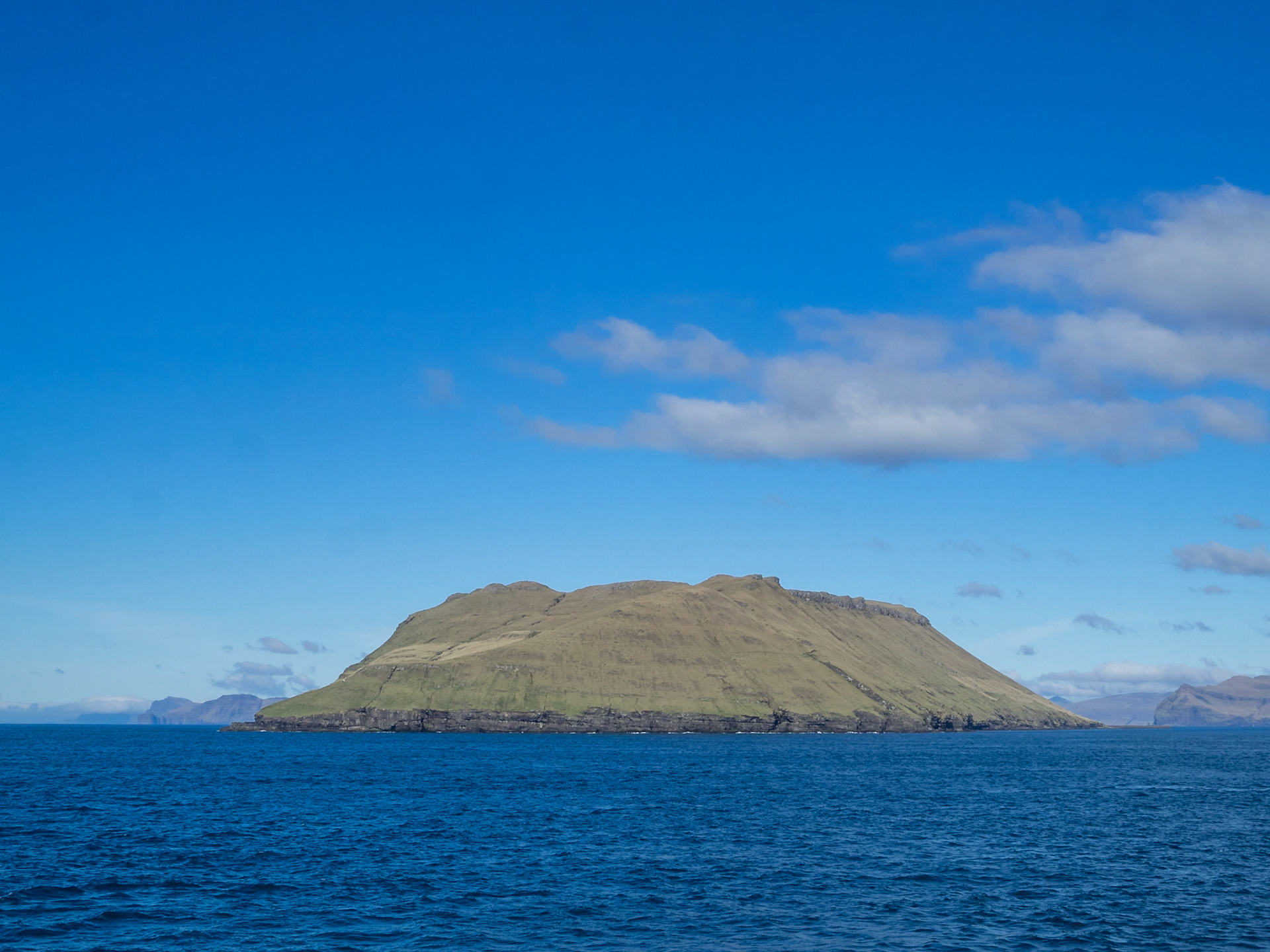 Hestur island flat top seen from Skopunarfjørður crossing