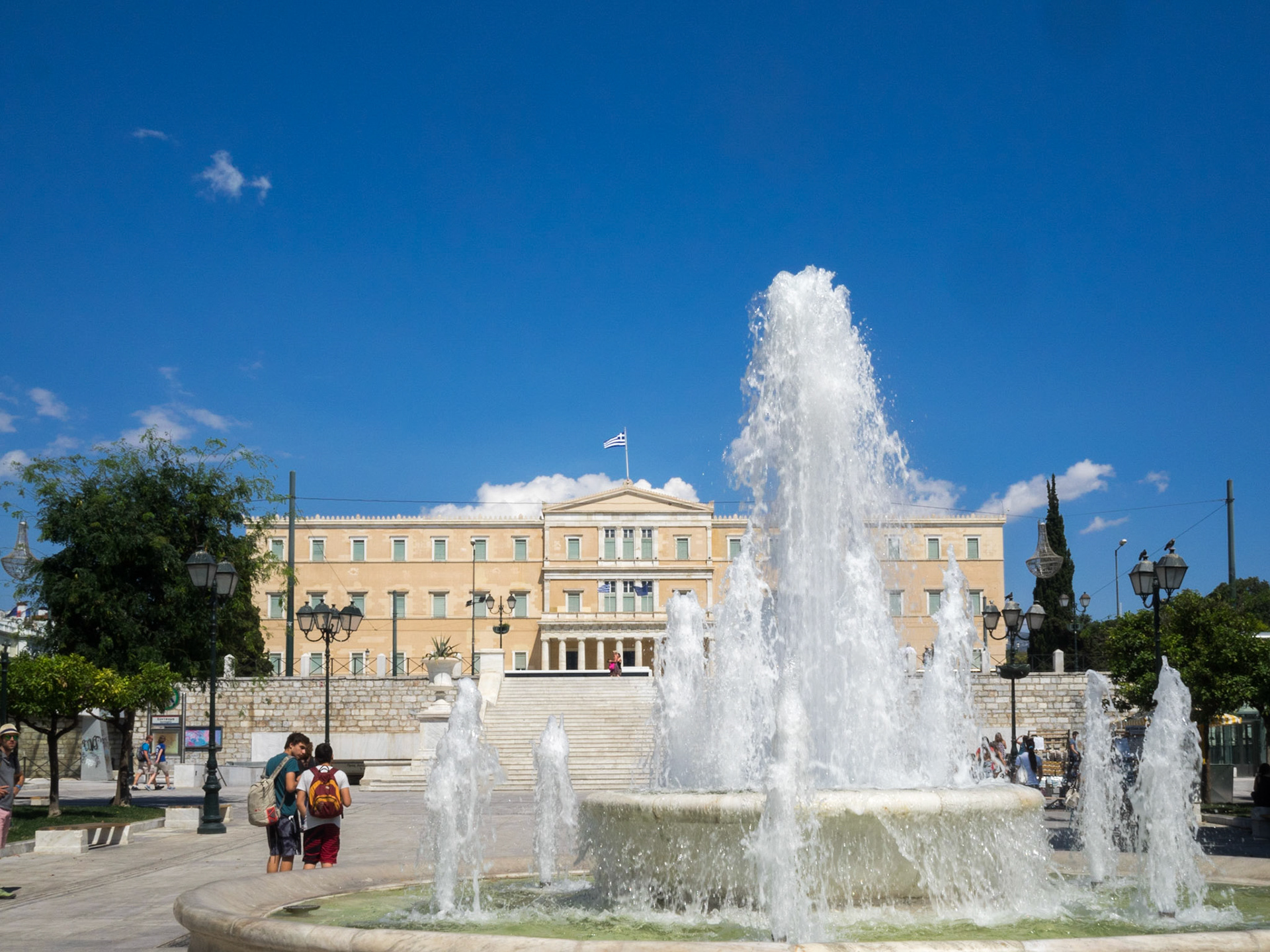 Syntagma square fountain with Greek parliament in background