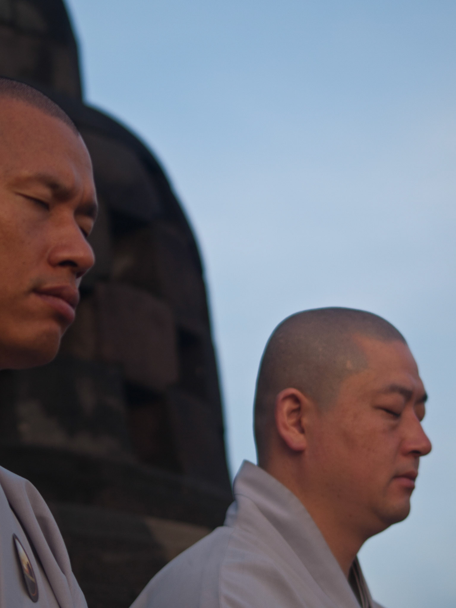 Buddhist monk praying at dawn in Borobudur temple
