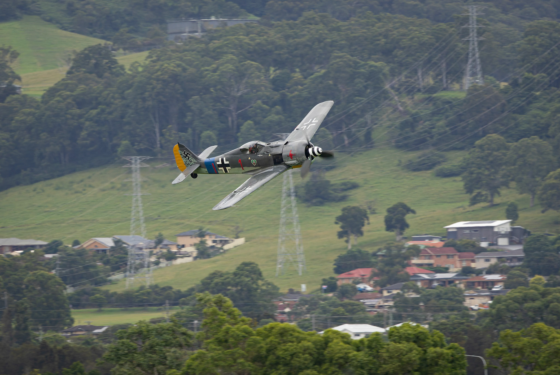 Focke-Wulf FW190 A8 being chased at the Shellharbour Airport, during the Airshows Downunder Shellharbour, New South Wales, Australia.