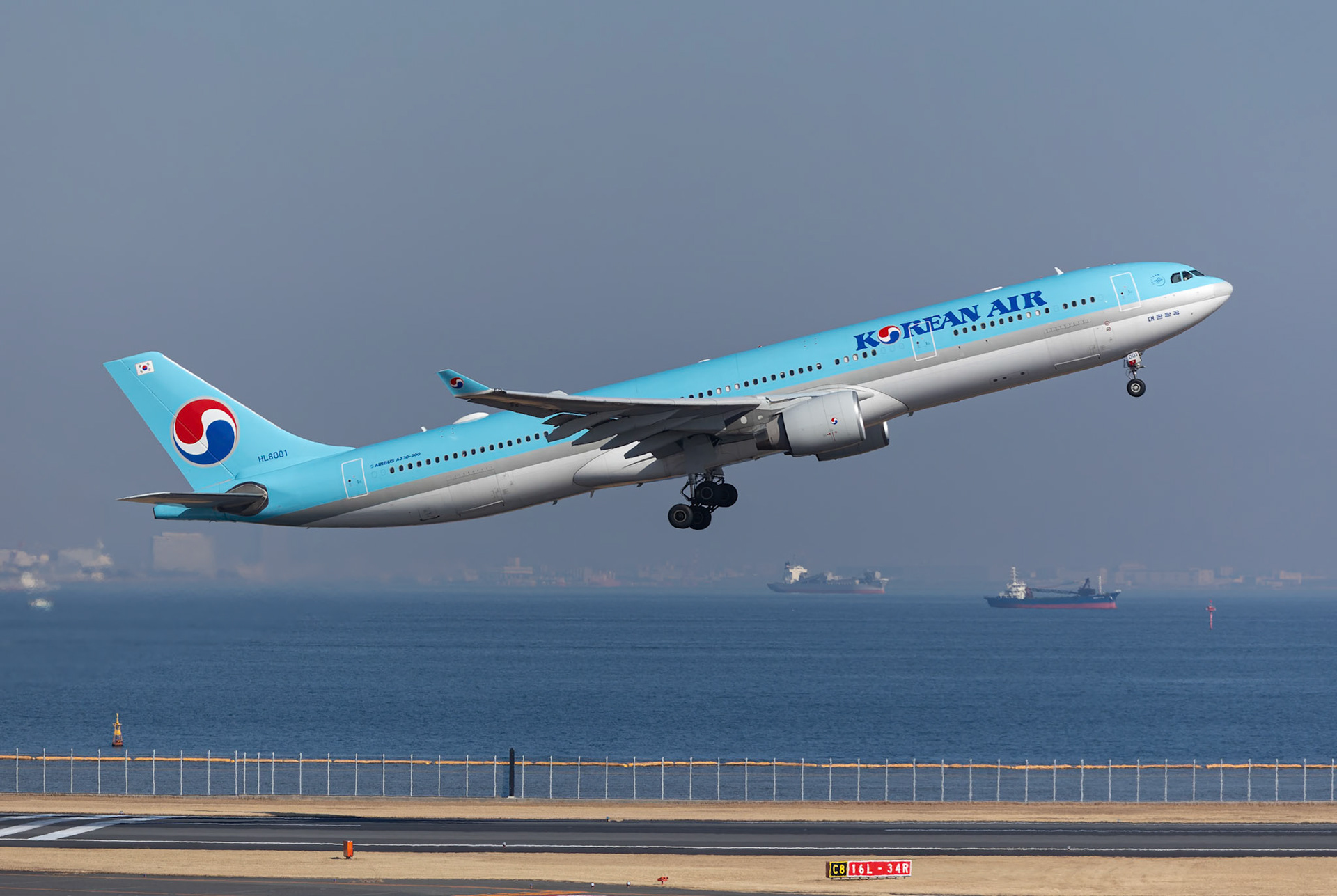 Korean Air Airbus A330-300 (HL8001) Departing to Gimpo Int'l, captured from Terminal 2 viewing platform at Haneda Airport in Tokyo, Japan