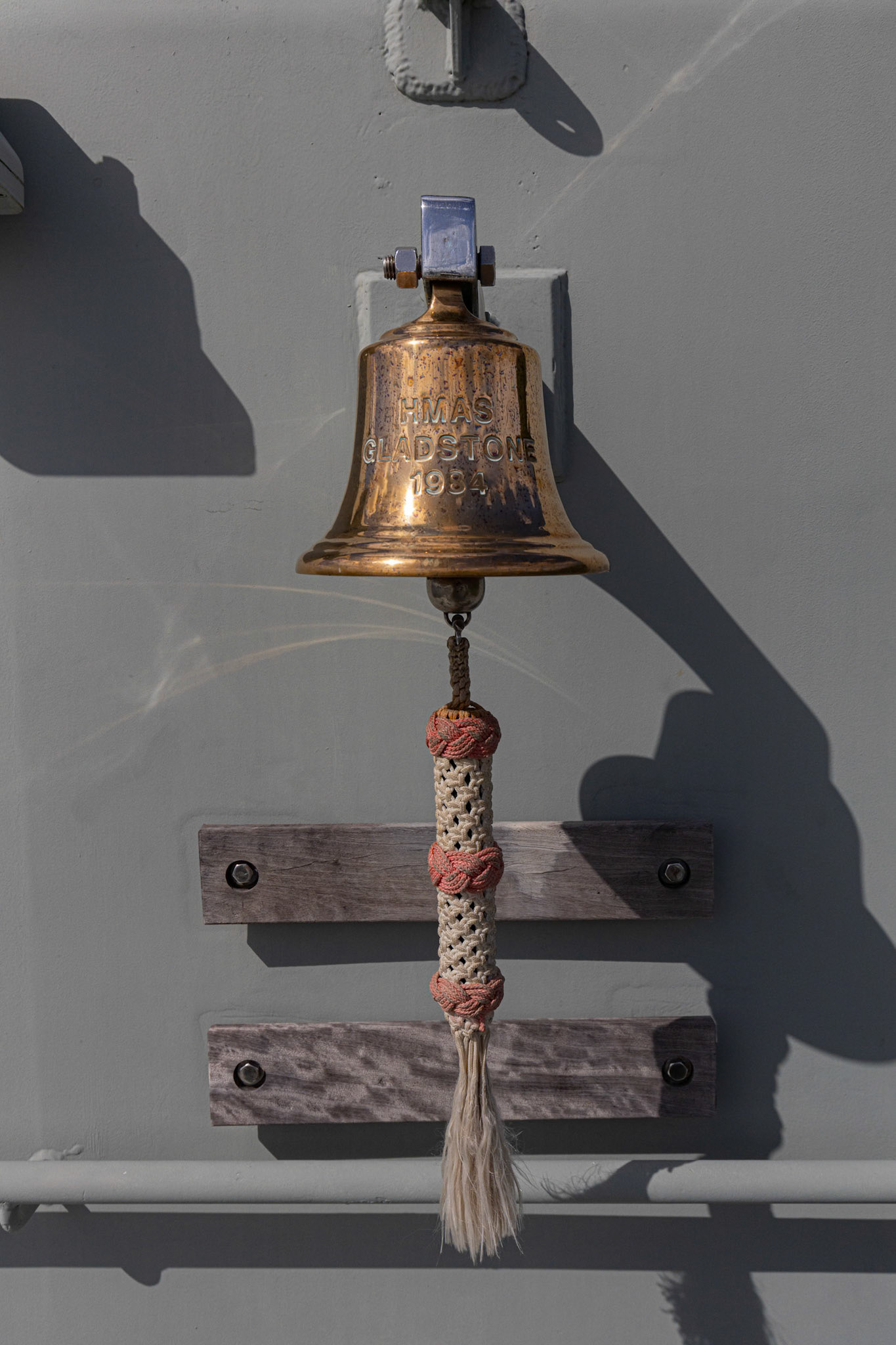 The ship's bell onboard the HMAS Gladstone, in Gladstone, Australia
