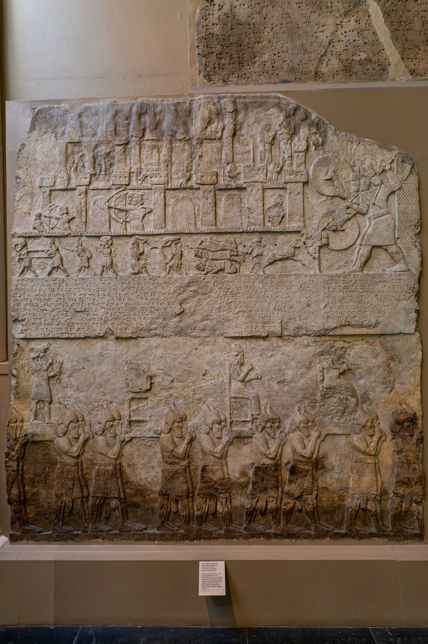 Wall panel 'Attack on an Enemy Town' on display at British Museum, London