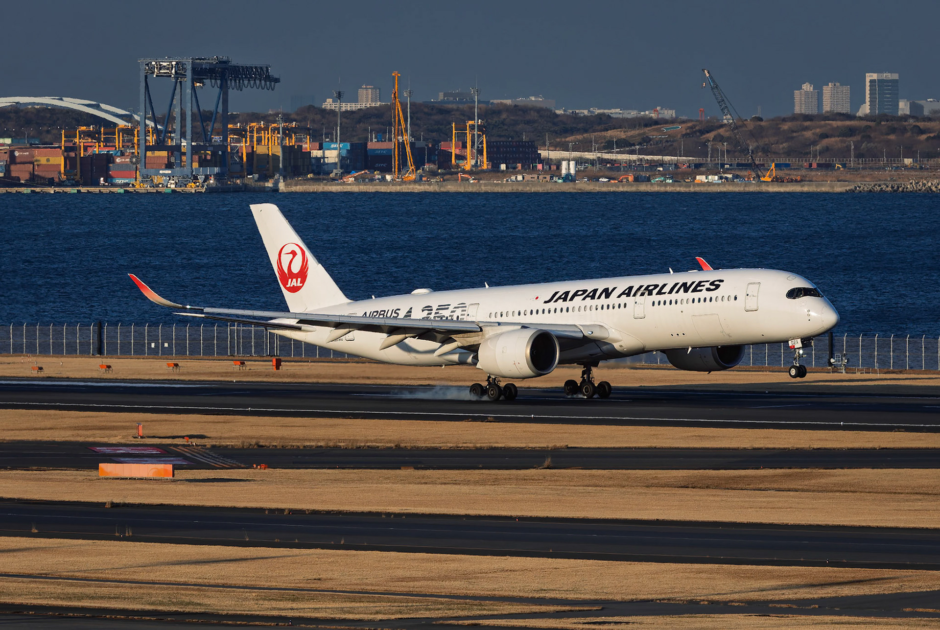 Japan Airlines Airbus A350-941 (JA02XJ) Arriving from Fukuoka, Japan, captured from Terminal 2 viewing platform at Haneda Airport in Tokyo, Japan