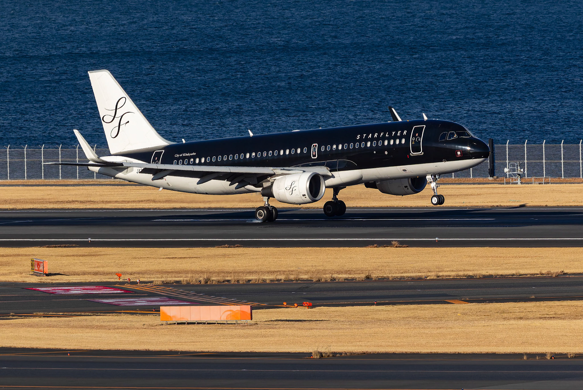 Starflyer Airbus A320-214 (JA26MC) Arriving from Kitakyushu, Japan, captured from Terminal 2 viewing platform at Haneda Airport in Tokyo, Japan