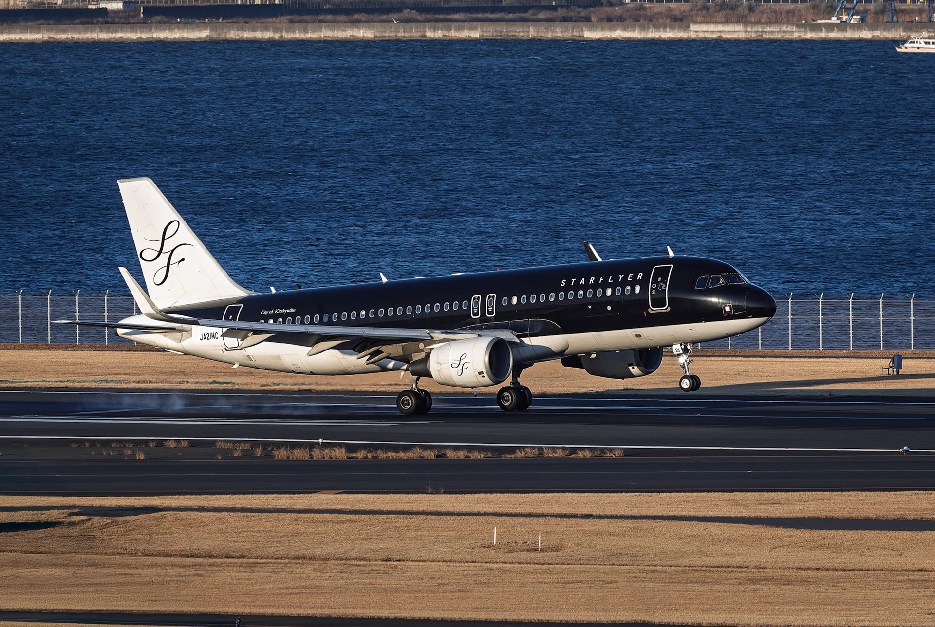 Starflyer Airbus A320-214 (JA21MC) Arriving from Kitakyushu, Japan, captured from Terminal 2 viewing platform at Haneda Airport in Tokyo, Japan