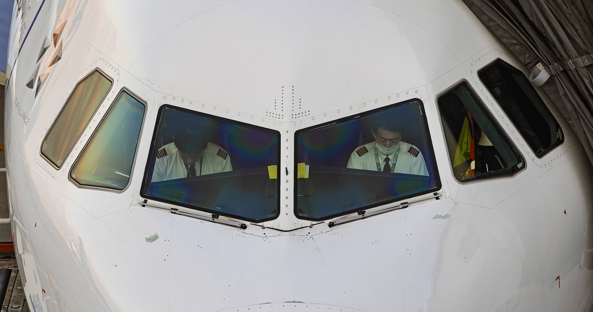 ANA aircraft docked into Terminal 2, captured from Terminal 2 viewing platform at Haneda Airport in Tokyo, Japan