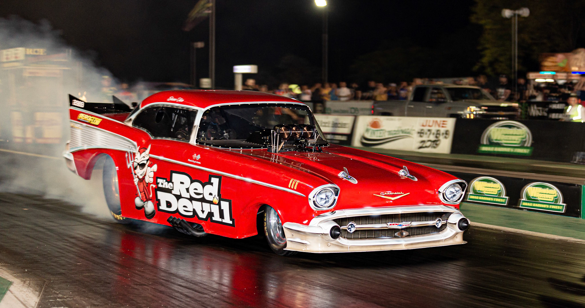 Competitor 'The Red Devil' starting a run at the Aeroflow Outlaw Nitro Funnycar event on the 9th of November, 2019 at Willowbank Raceway in Queensland, Australia