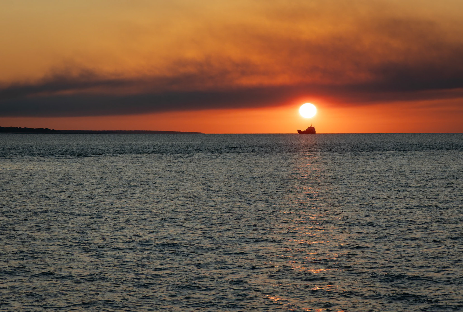 The sun setting on the Sunset Dinner Cruise on Cape Adieu in Northern Territory, Australia