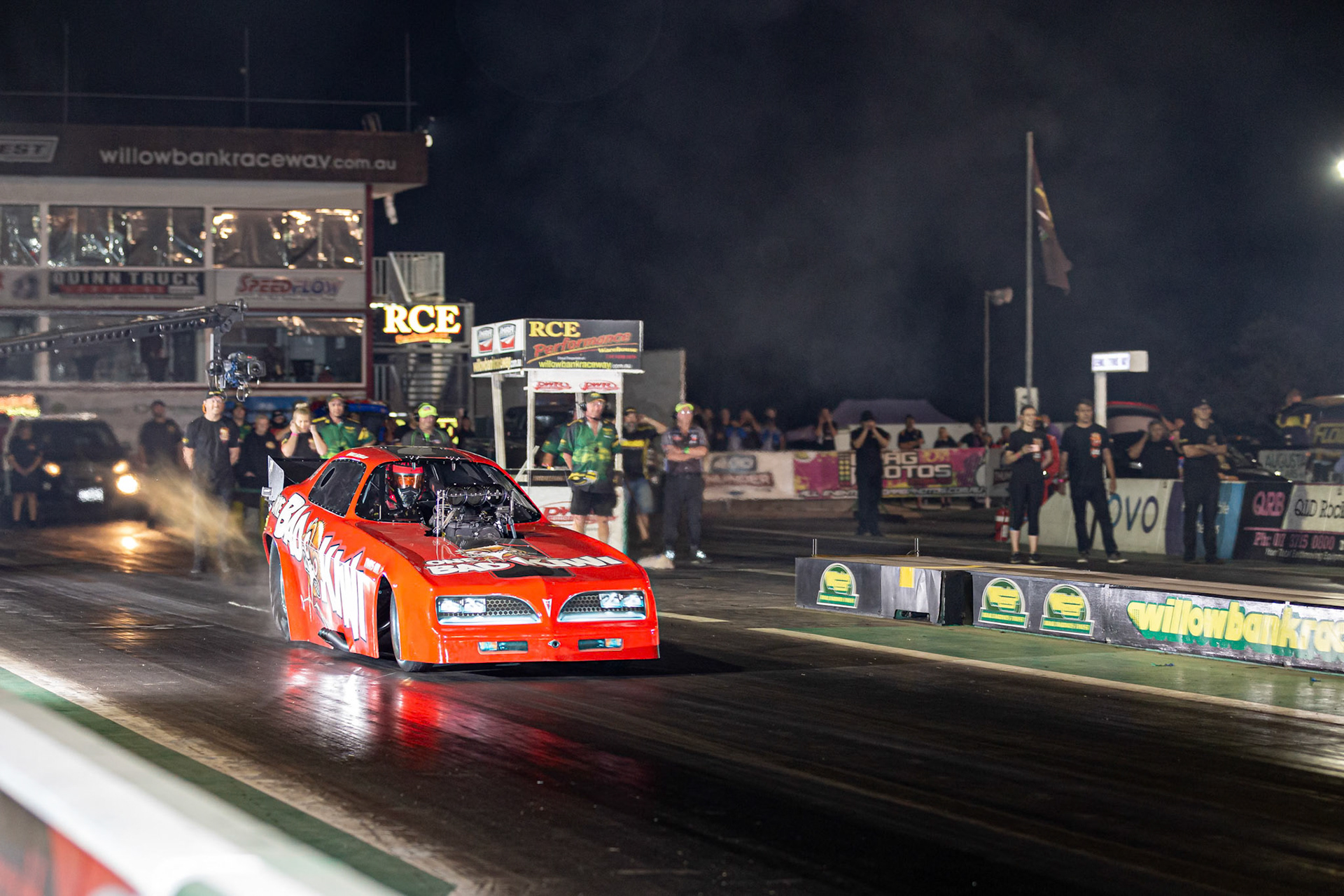 Competitor 'One Bad Kiwi' starting a run at the Aeroflow Outlaw Nitro Funnycar event on the 9th of November, 2019 at Willowbank Raceway in Queensland, Australia