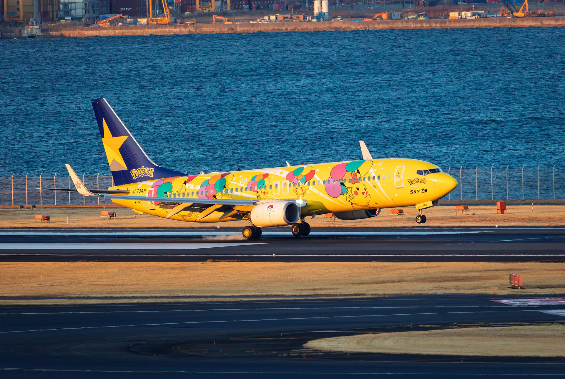 Skymark Airlines Boeing 737-8AL (JA73AB) Arriving from Fukuoka, Japan, captured from Terminal 2 viewing platform at Haneda Airport in Tokyo, Japan