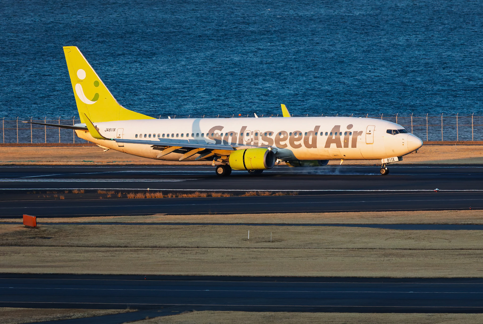 Solaseed Air Boeing 737-86N (JA811X) Arriving from Mashiki, Japan, captured from Terminal 2 viewing platform at Haneda Airport in Tokyo, Japan