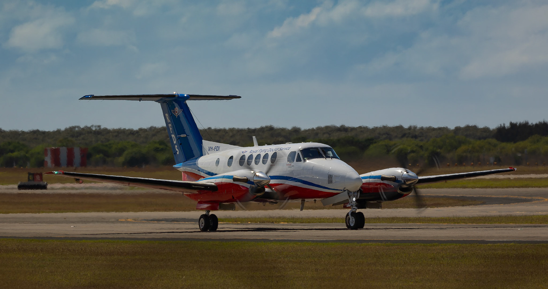 Royal Flying Doctors Service Australia Beech King Air 200C VH-FDI (FD467) departing Brisbane airport to Rockhampton, Australia
