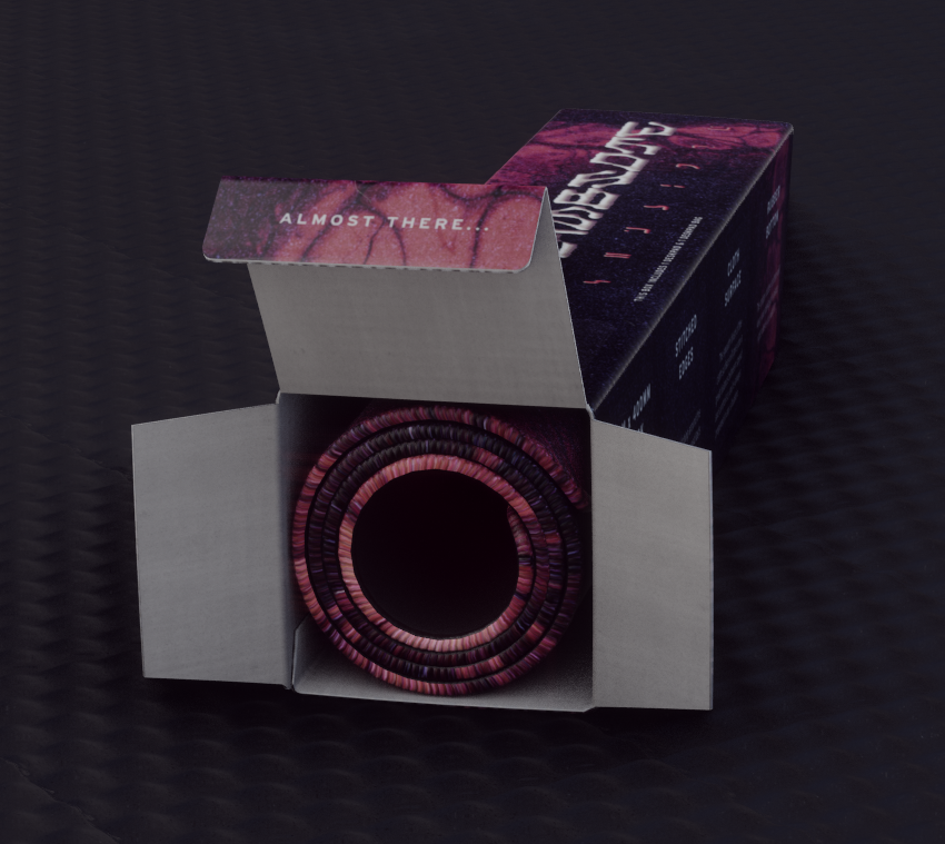 Rigged deskpad rolled inside packaging