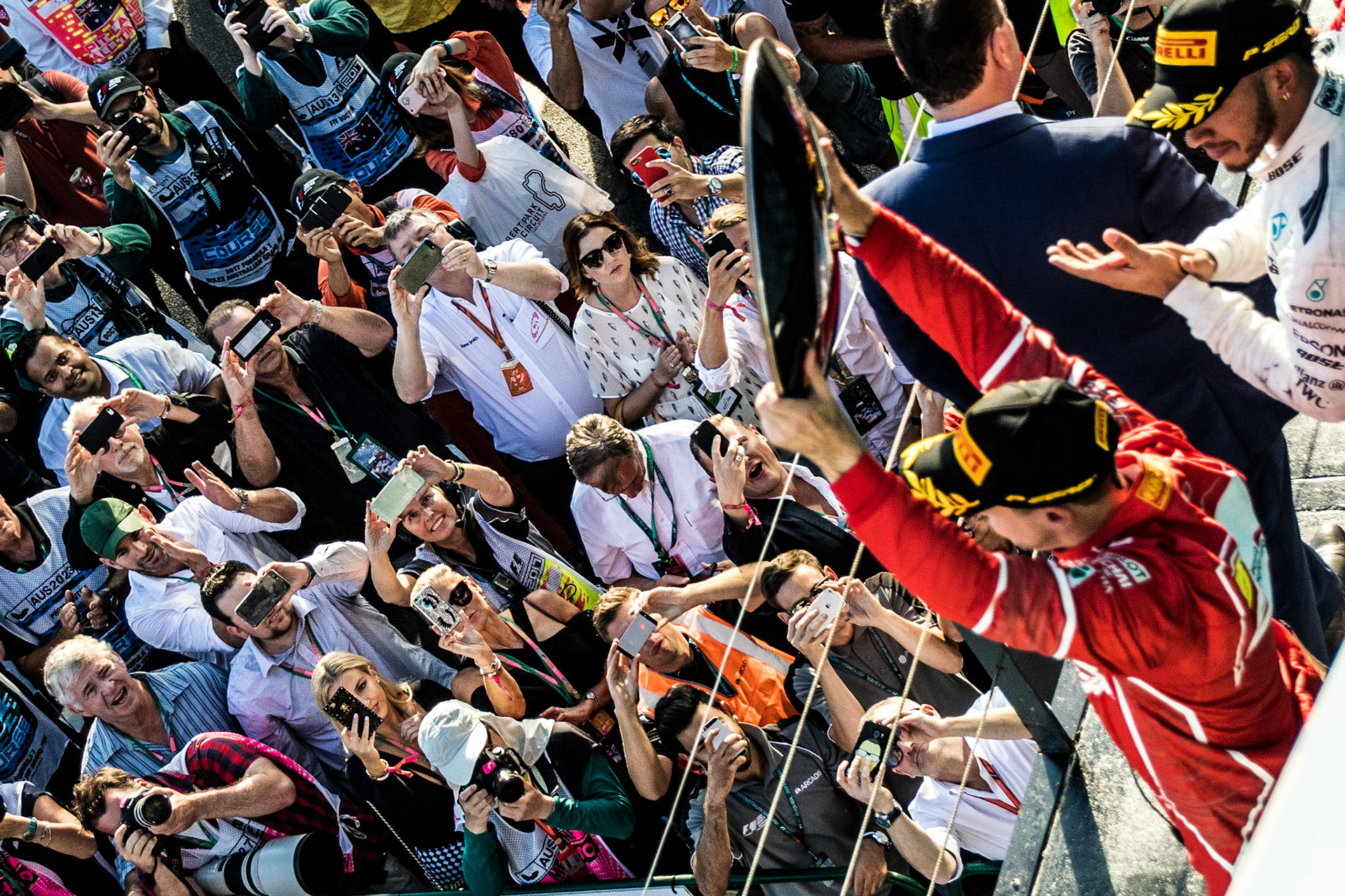 Ferrari driver Sebastian Vettel (5) of Germany celebrates on the podium following the Australian Formula 1 Grand Prix 2017