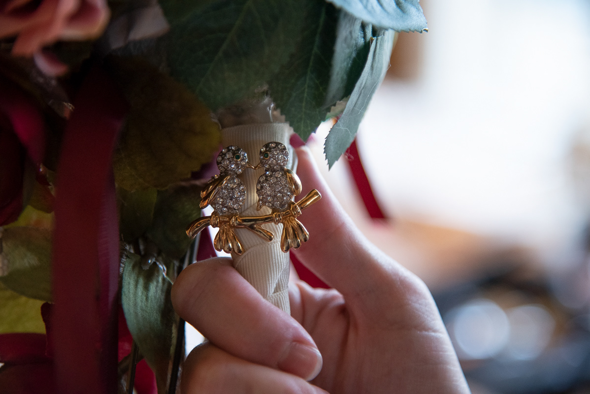 Close up photograph of bouquet pin by Wedding Photographer Lexington Ky | Davron Bowman