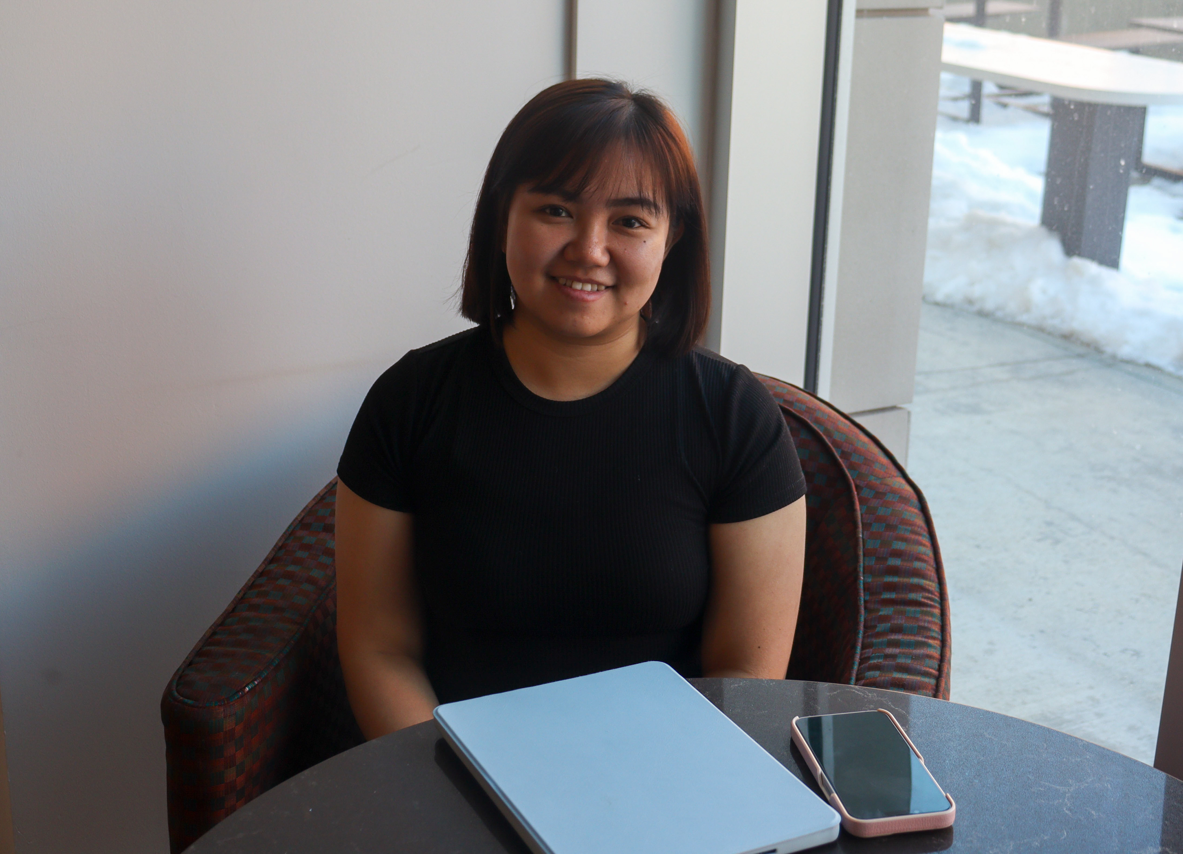 Anthonette Sabanpan, Steering Committee striking a causal pose at the John Ware Cafeteria, SAIT, Calgary on March 27,2024.