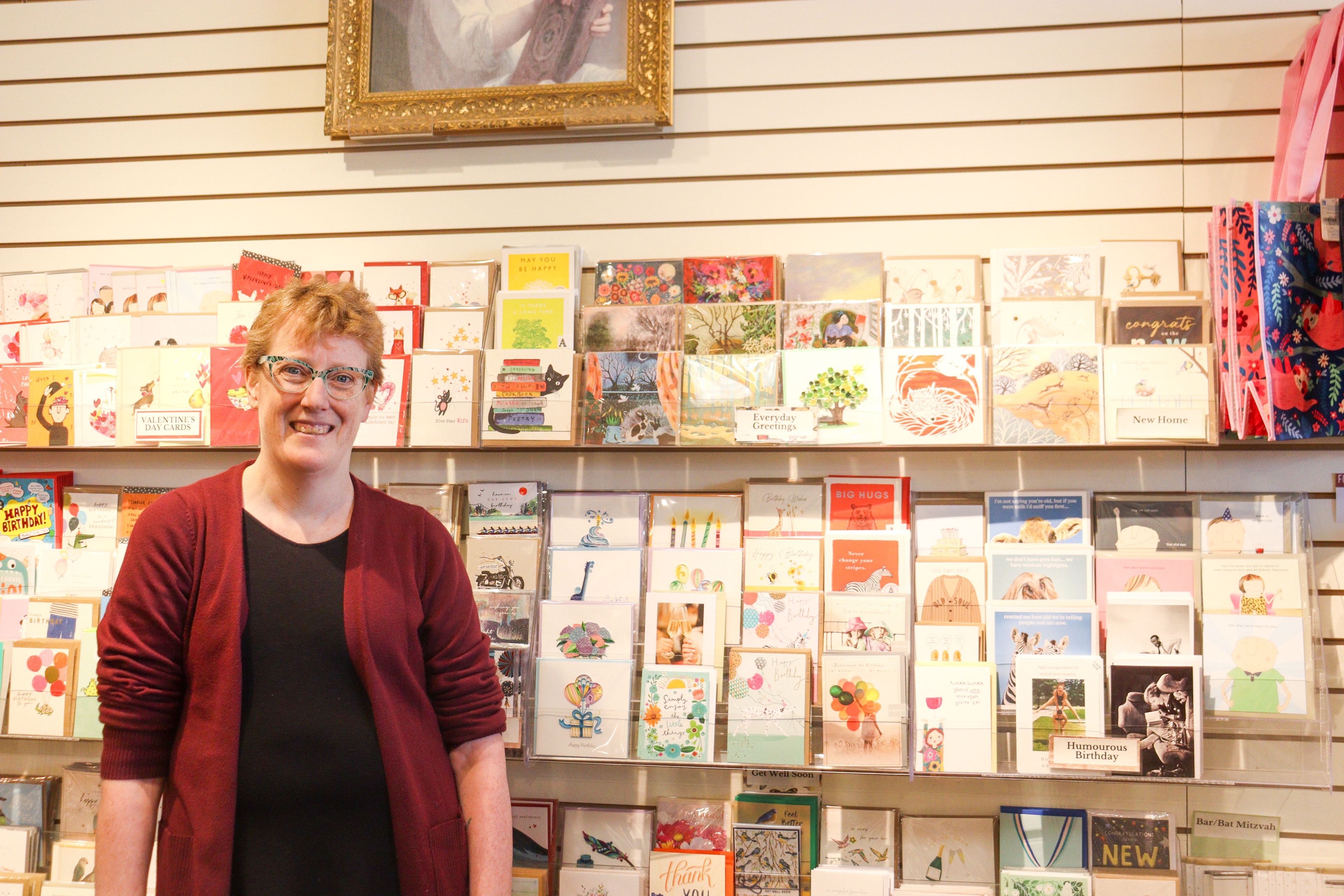 Judith Duthie, one of the co-owners of Owls Nest bookstore, Calgary is photographed in the bookstore on Feb.11, 2025
