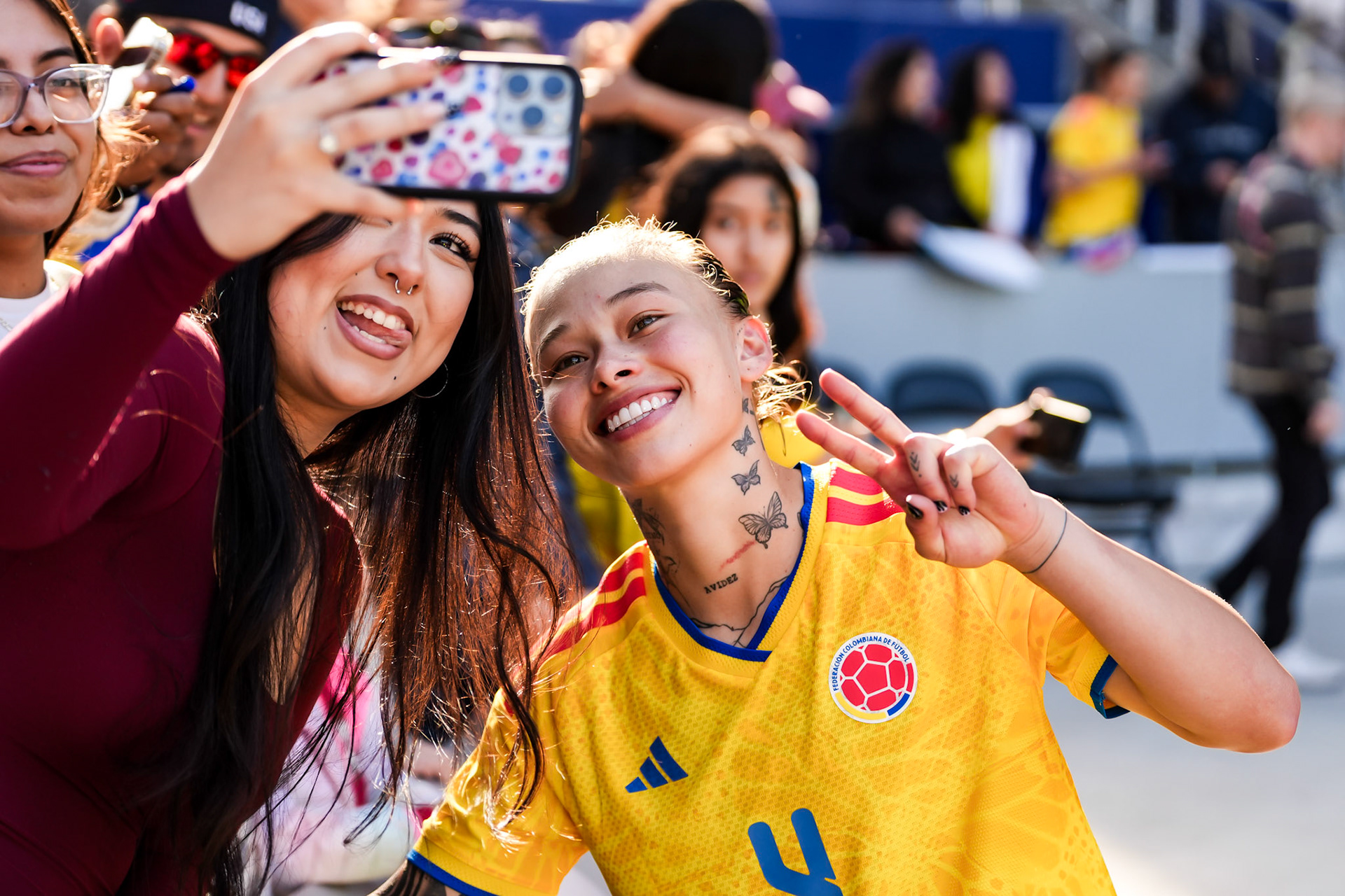 Colombia Women’s National Team player shares a selfie moment with a fan.