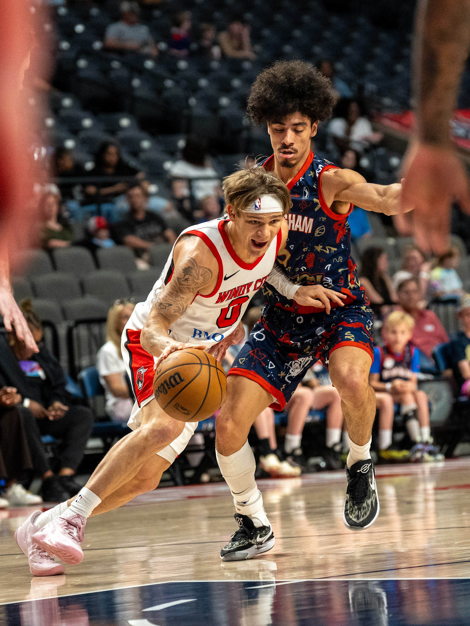 Windy City Bulls guard Mac McClung (0) drives past a Birmingham Squadron defender.