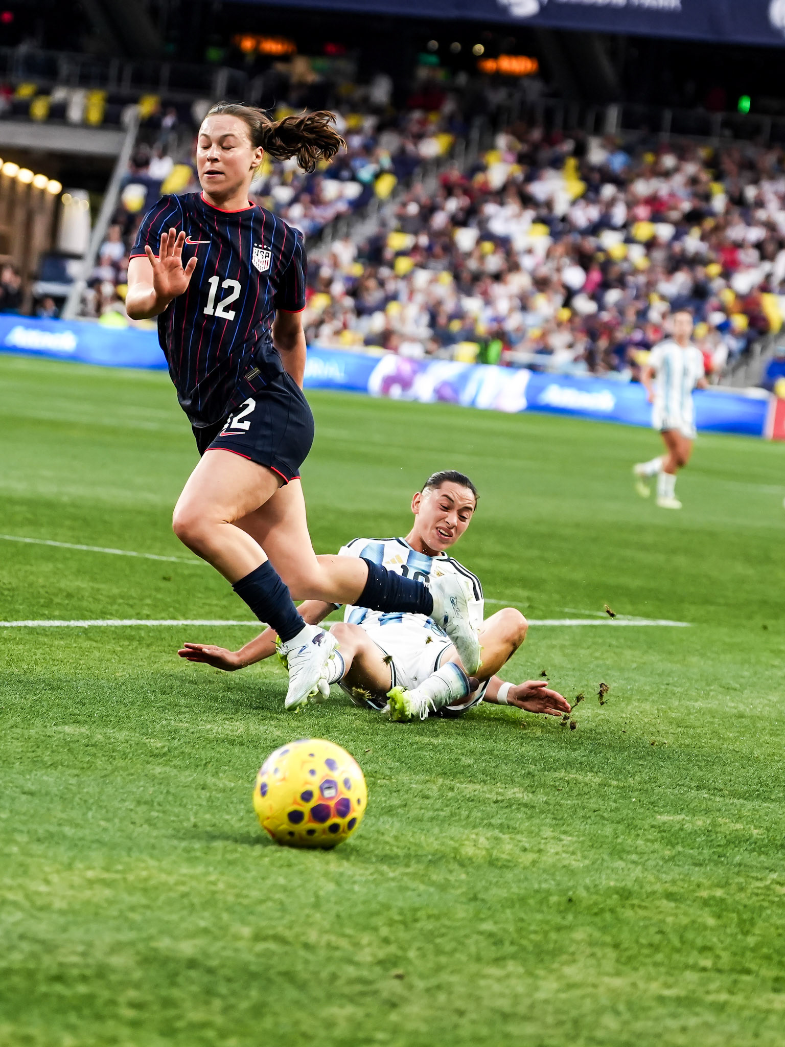 USWNT defender Gisele Thompson (12) battles for possession against an Argentina Women’s National Team player.