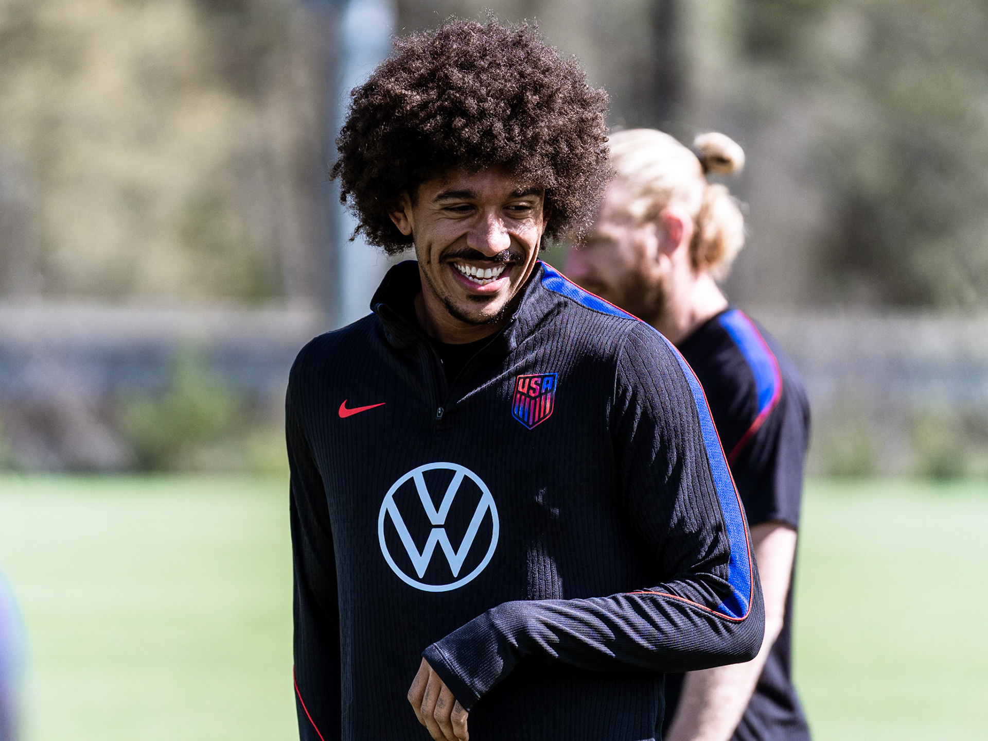USMNT defender Chris Richards smiles during training.
