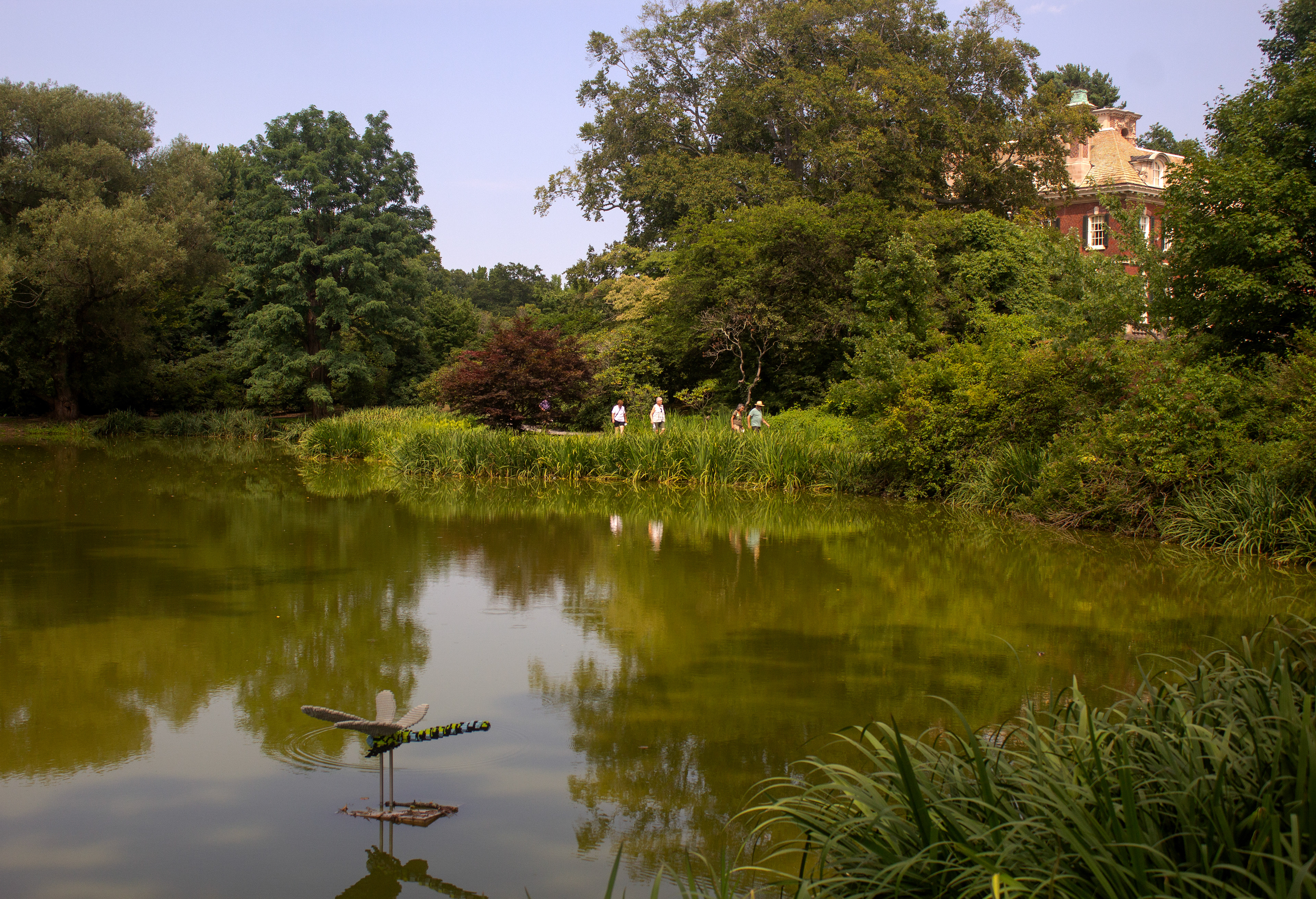 Visitors walking the pathway between The West Pond and The Westbury House. Old Westbury, NY.