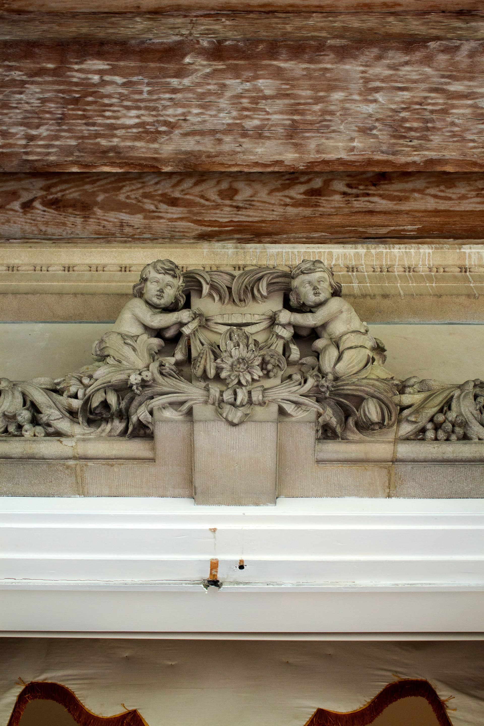 Above the enterance to the West Porch located on the first floor. Old Westbury, NY.