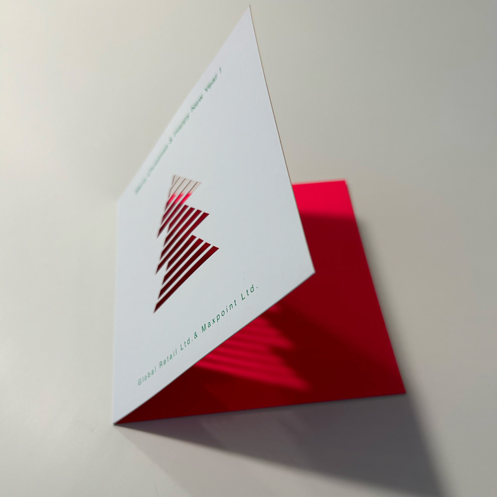 Die-cut with fluorescent spot colour