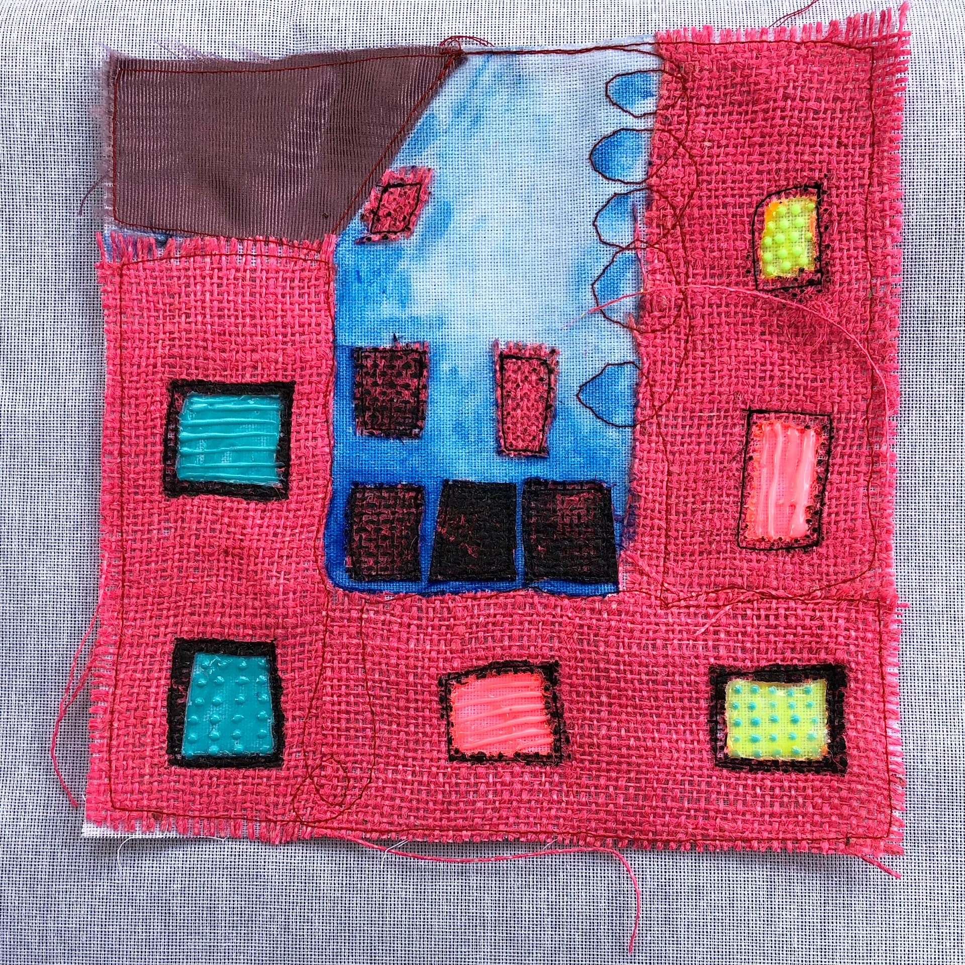 Architexture Collages (2018) buckram, silkscreened burlap, moiré fabric, glow in the dark paint, acrylic, thread // Lit screens, windows, skies & building blocks. From a set of five.