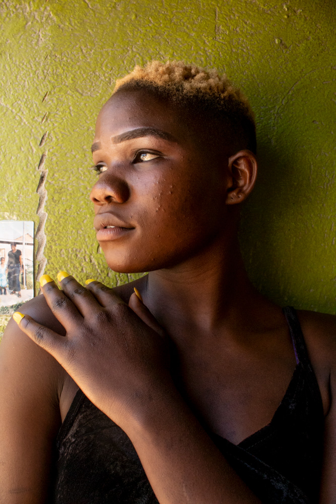 Dione Manjoro says she was born deaf but can hear some sounds if they are very, very loud. She prefers to sign as her own speech is not very clear.