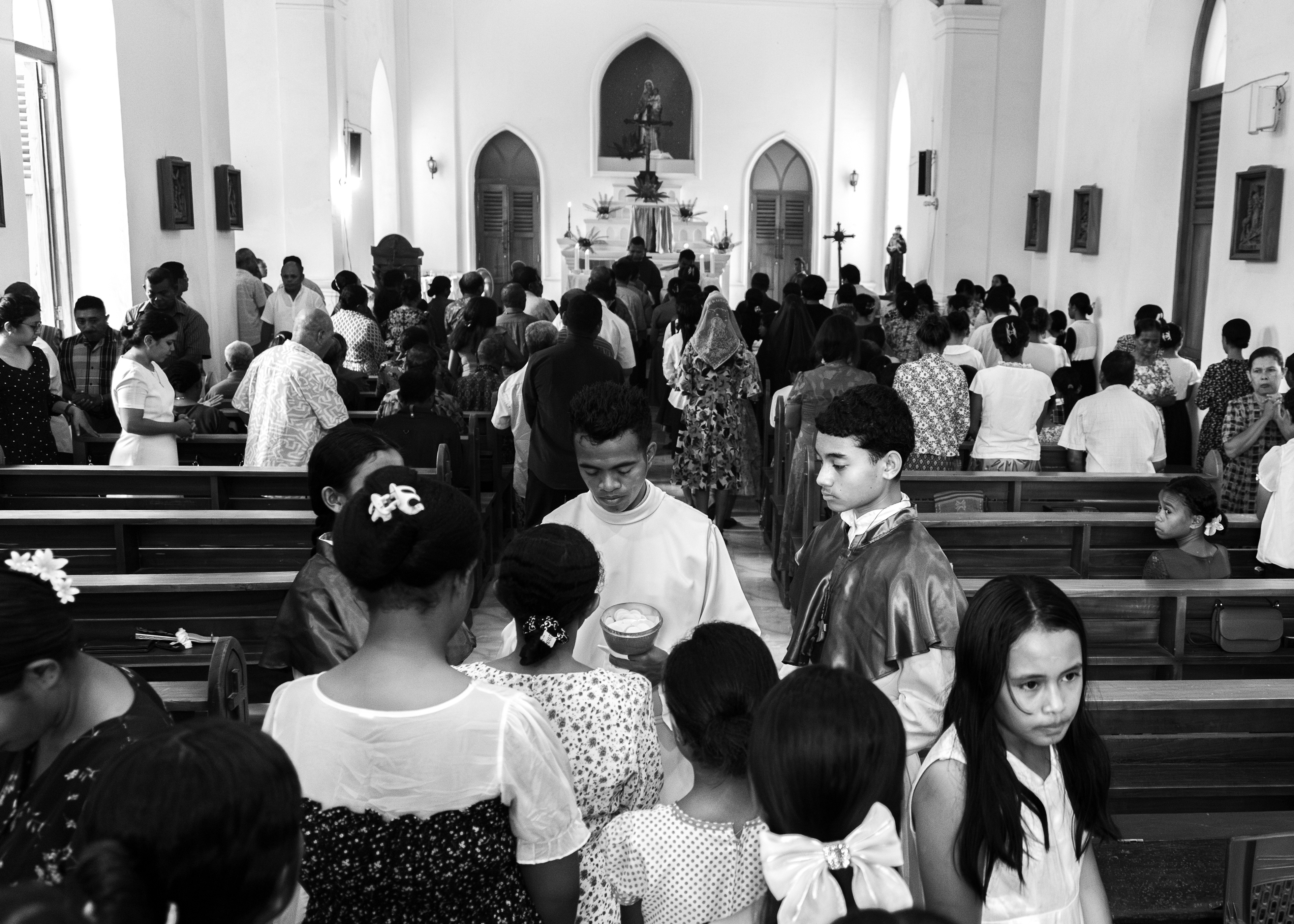 Sunday church services in Oecusse strongly reflect the local community's deep faith in Christianity