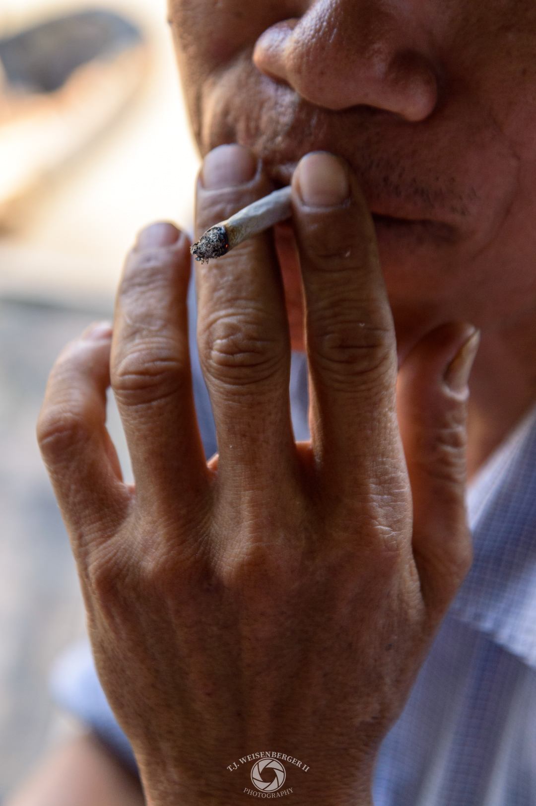 Hands Cai Rang Floating Market Boatman Smoking Handrolled Cigarette - Can Tho, Vietnam
