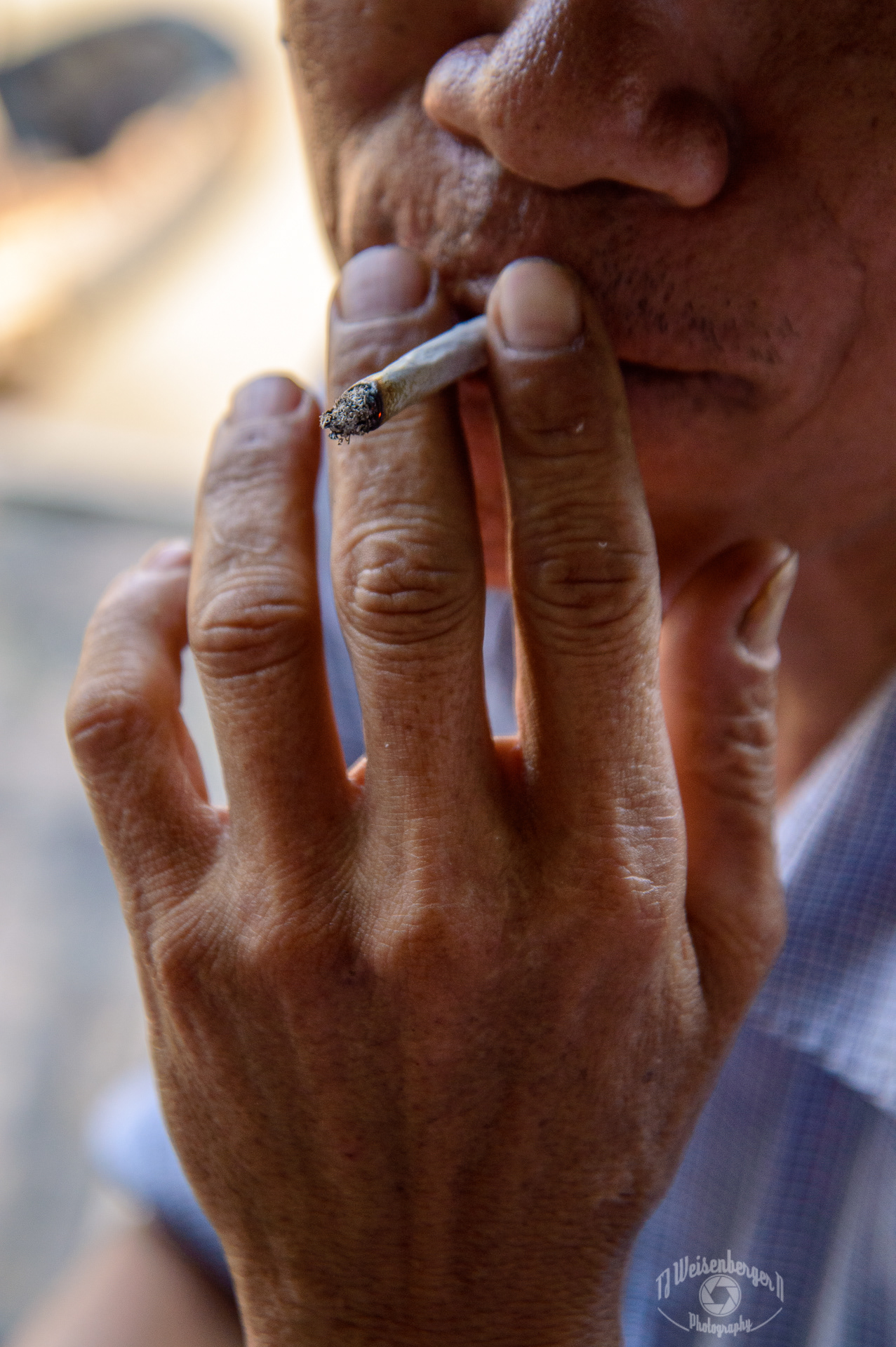 Hands Cai Rang Floating Market Boatman Smoking Handrolled Cigarette - Can Tho, Vietnam
