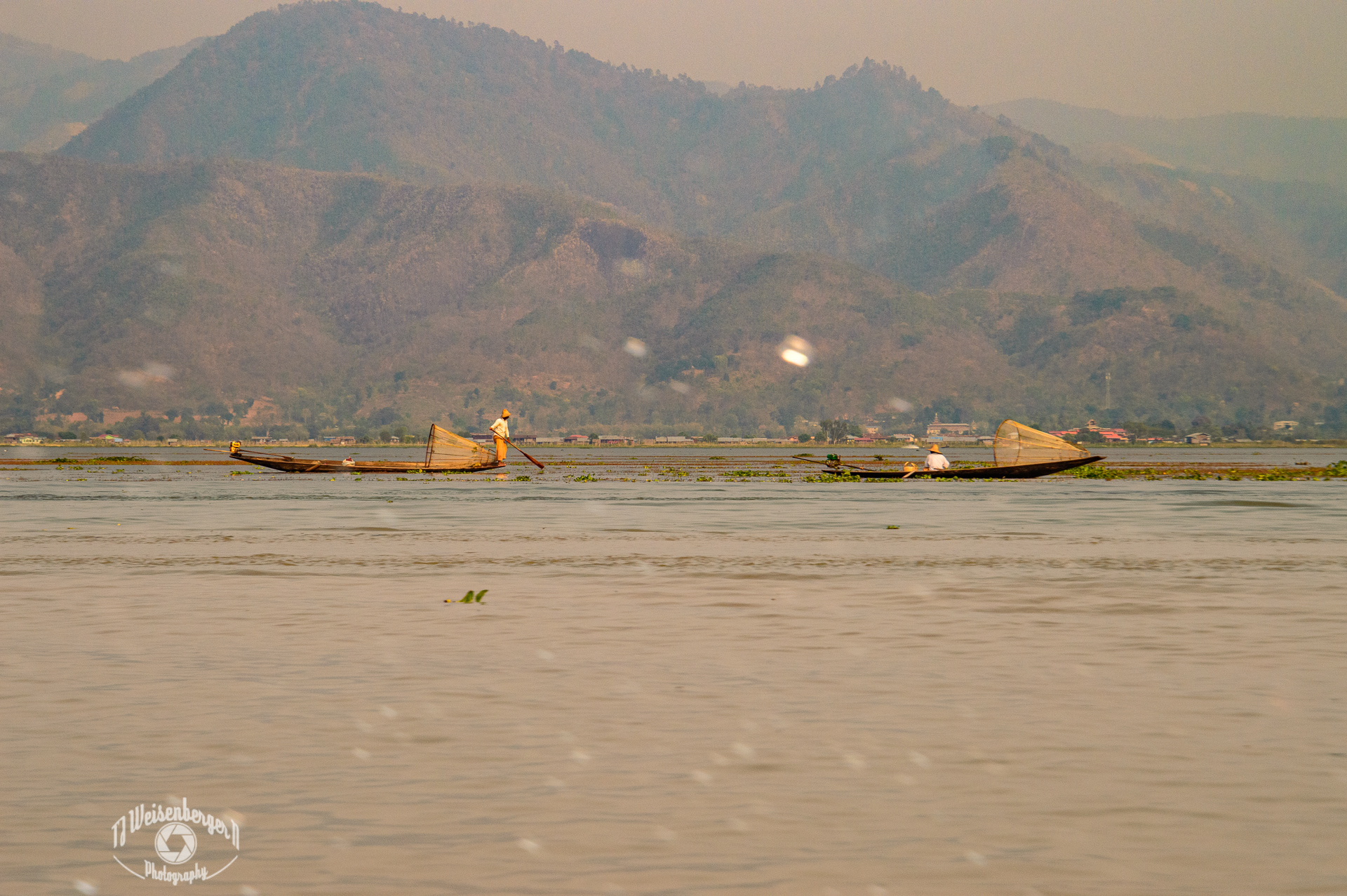 Intha, Traditional Basket Fishermen of Inle Lake - Burma Myanmar; Asia; Basket; Boat; Boats; Burma; Burmese; Canoe; Environment; Famous Place; Fishermen; Inle; Inle Lake; Intha; Intha Fishermen; Lake; Landscape; Landscape - Scenery; Longtail; Mountain; Net; People; Photography; Planet Earth; Scenics - Nature; Skiff; Southeast Asia; Spring; Sunny; Sunset; Tourism; Tradition; Traditional; Travel; Travel Destinations; Water; fisherman; inya lake; labor; myanmar; nature; outdoors; tradesman; work; working; T.J.; TJ; Weiseberger