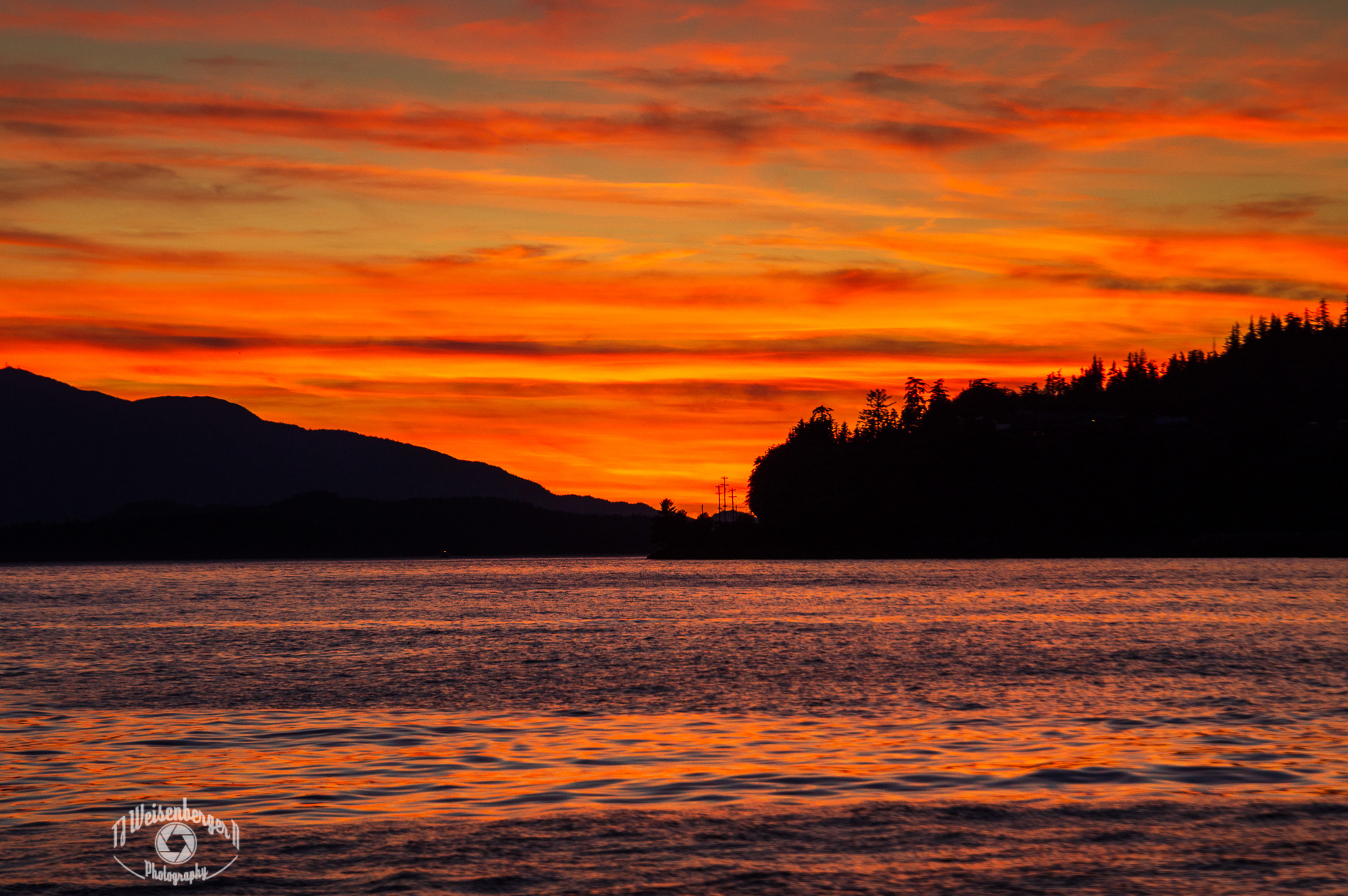 Burning Sunset - Near Ketchikan, Revillagigedo Island, Alaska; Alaska - US State; Backgrounds; Beauty; Beauty In Nature; Cloud - Sky; Dramatic Sky; Dusk; Getting Away From It All; Horizontal; Idyllic; Ketchikan; Landscape - Scenery; Majestic; Natural Phenomenon; No People; North America; Perfection; Photography; Reflection; Relaxation; Scenics - Nature; Sea; Sky; Summer; Sun; Sunlight; Sunset; Tranquil Scene; Tranquility; USA; Water; Water's Edge; nature; outdoors; T.J.; TJ; Weiseberger