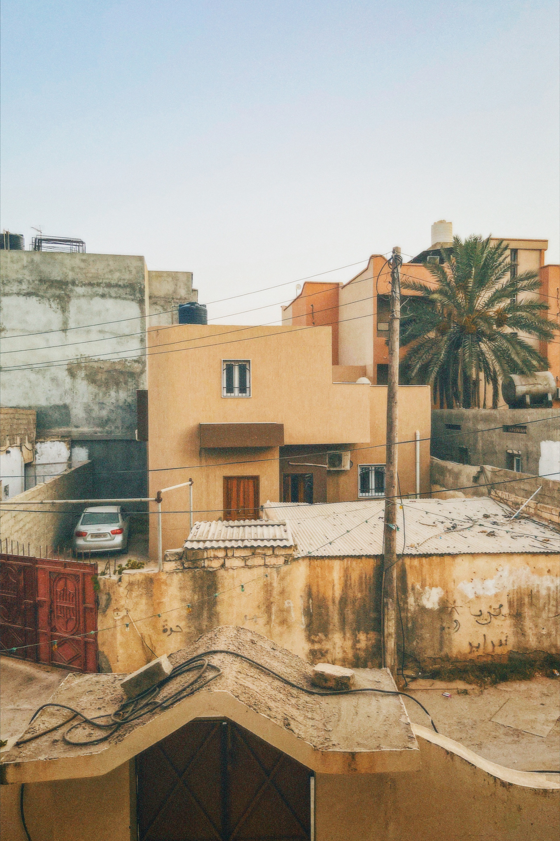 Houses stand with messages of a passerby.