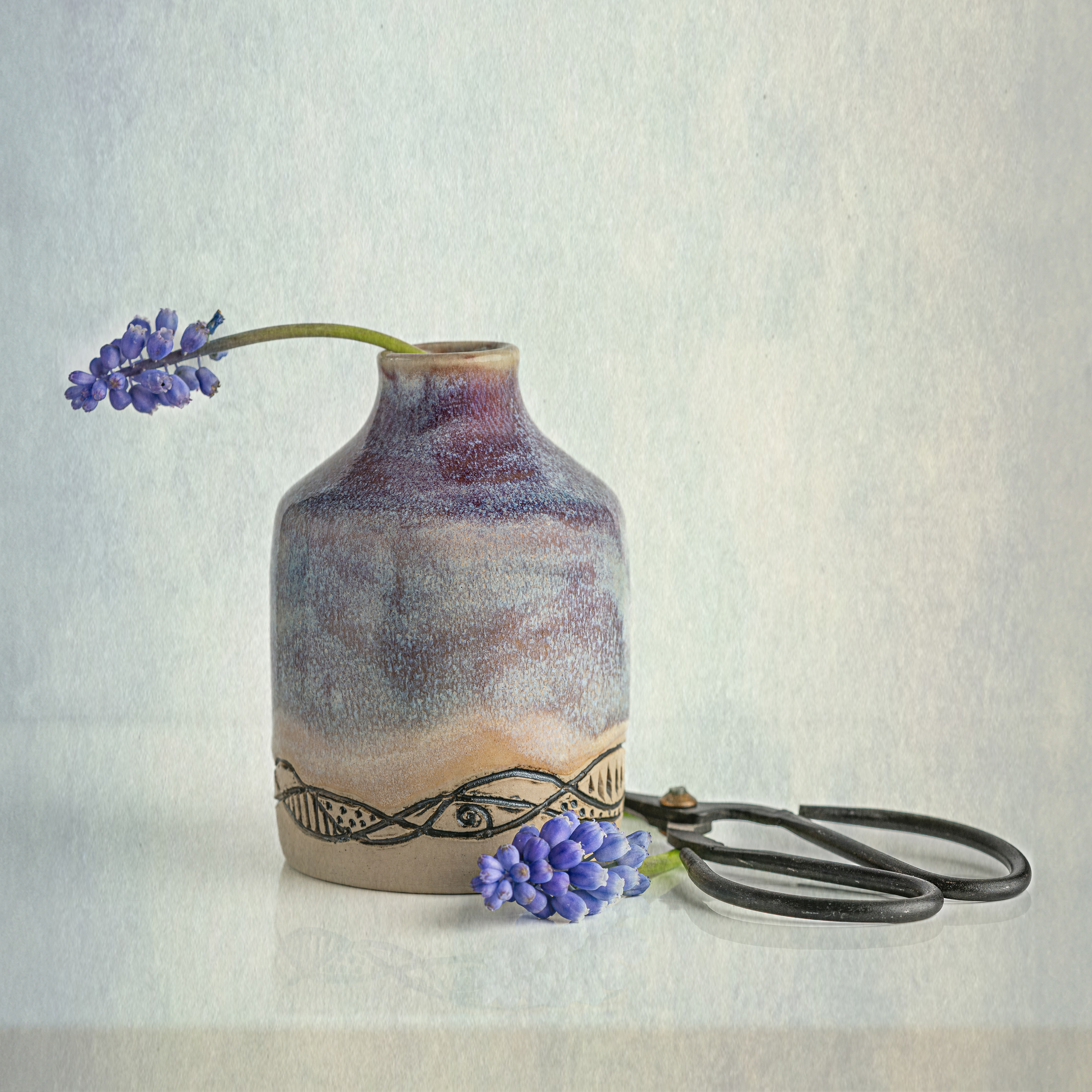 Grape Hyacinth in purple handmade vase