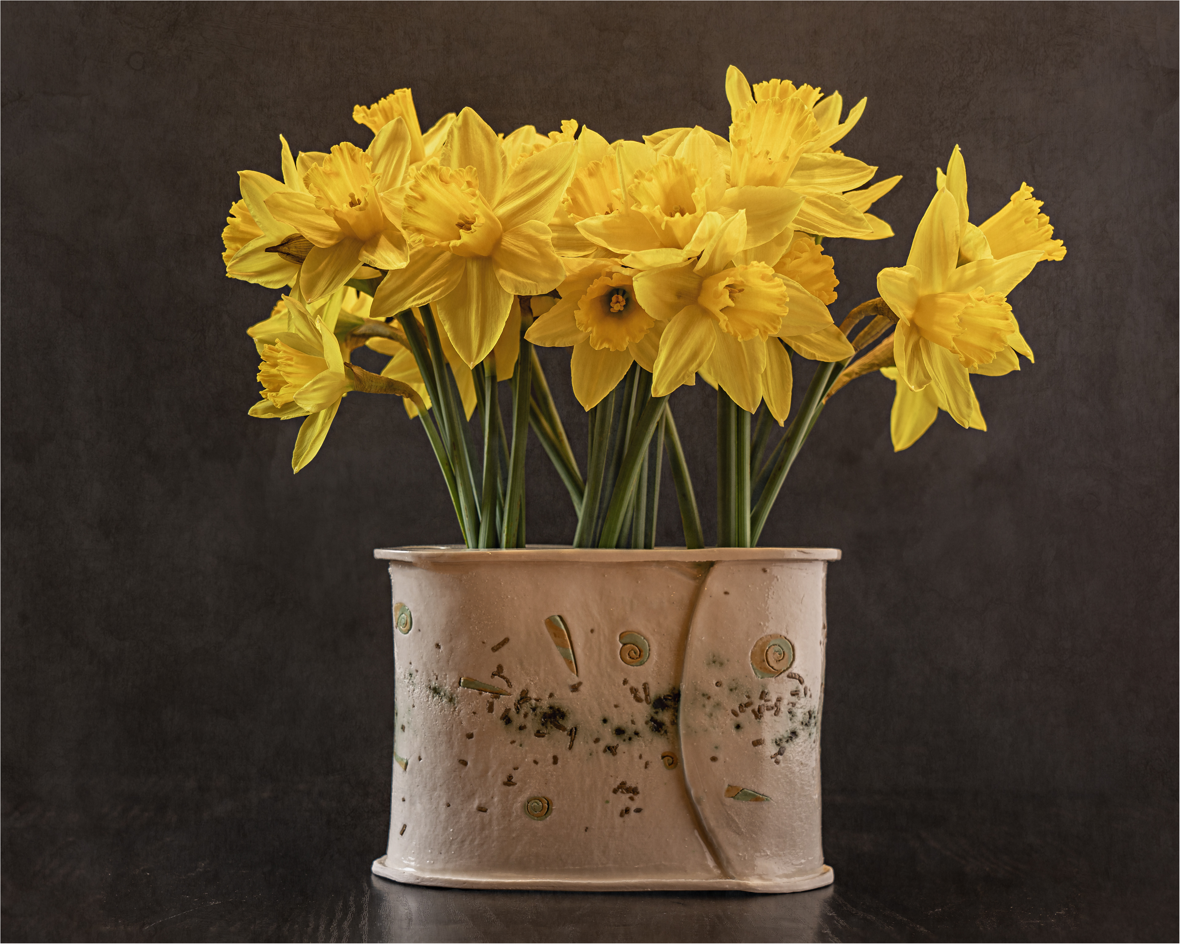 Daffodils in a handmade flower brick vase.