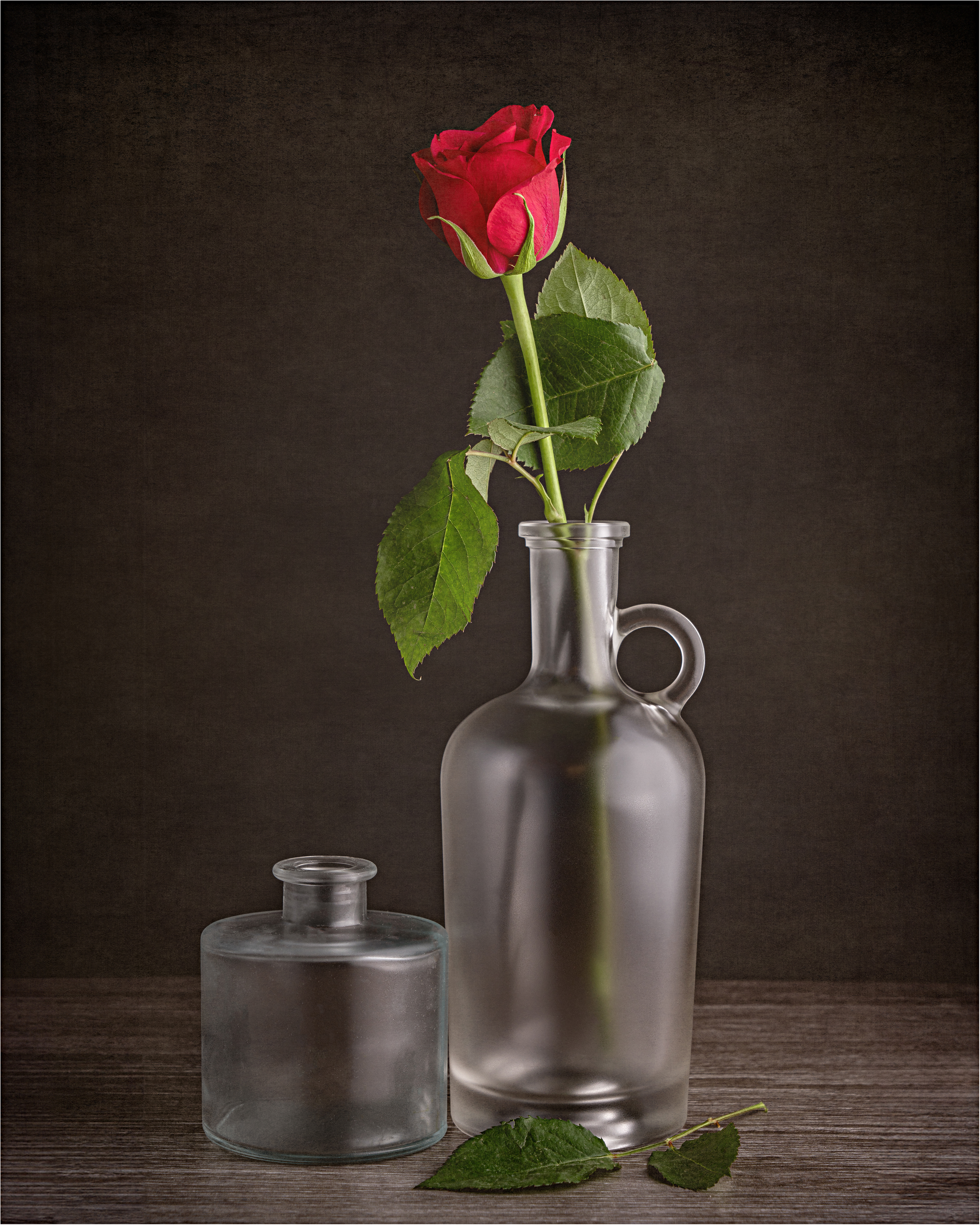 Single red rose in a bottle