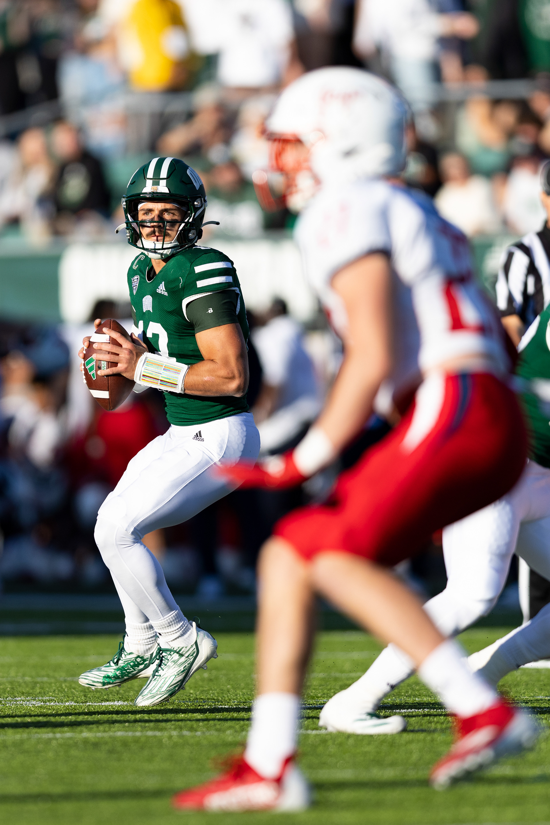 Parker Navarro (13) looks down field for an open receiver during the Bobcat’s game against Jaguar’s at Peden Stadium in Athens, Sept. 7, 2024.