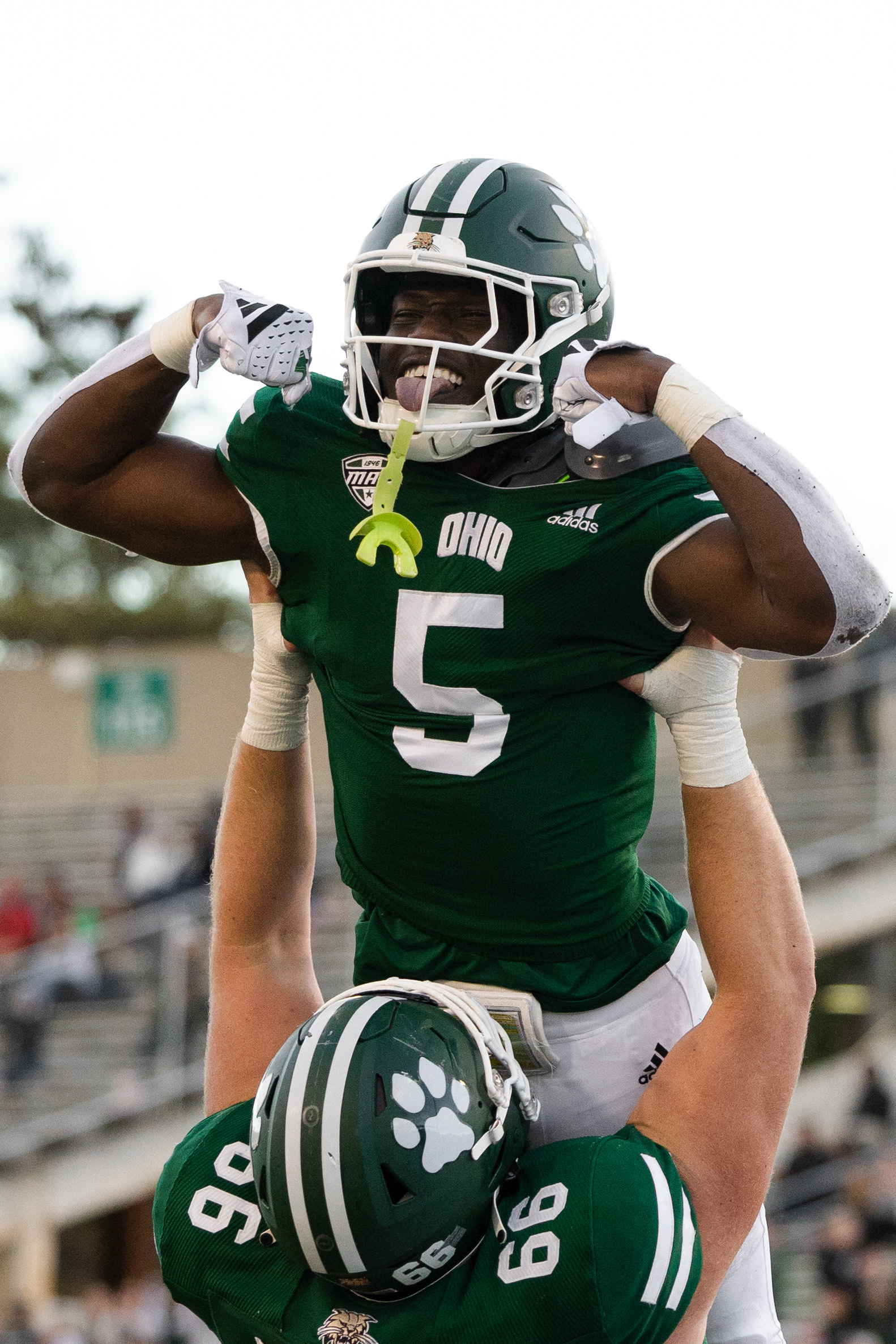Ohio running back, Sieh Bangura (5) is lifted into the air after his touchdown against Kent State at Peden Stadium in Athens, Ohio, Oct. 7, 2023.