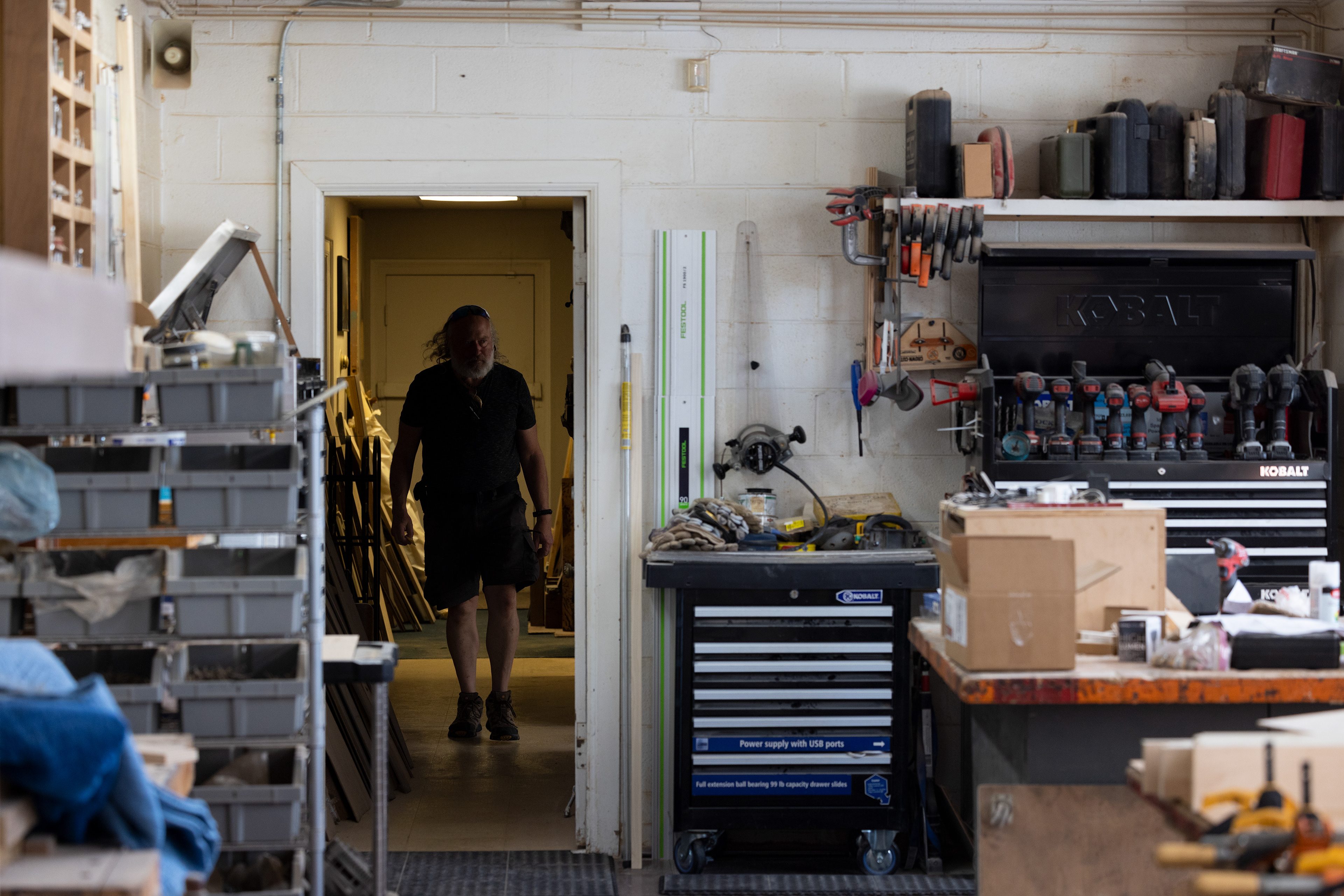 Chuck Harnack walks from his office into his workshop in Downtown Columbus, Ohio, Sept. 6, 2023. He will continue to work at his business until he wants to retire and when he does, he plans to restore antiques and artifacts.