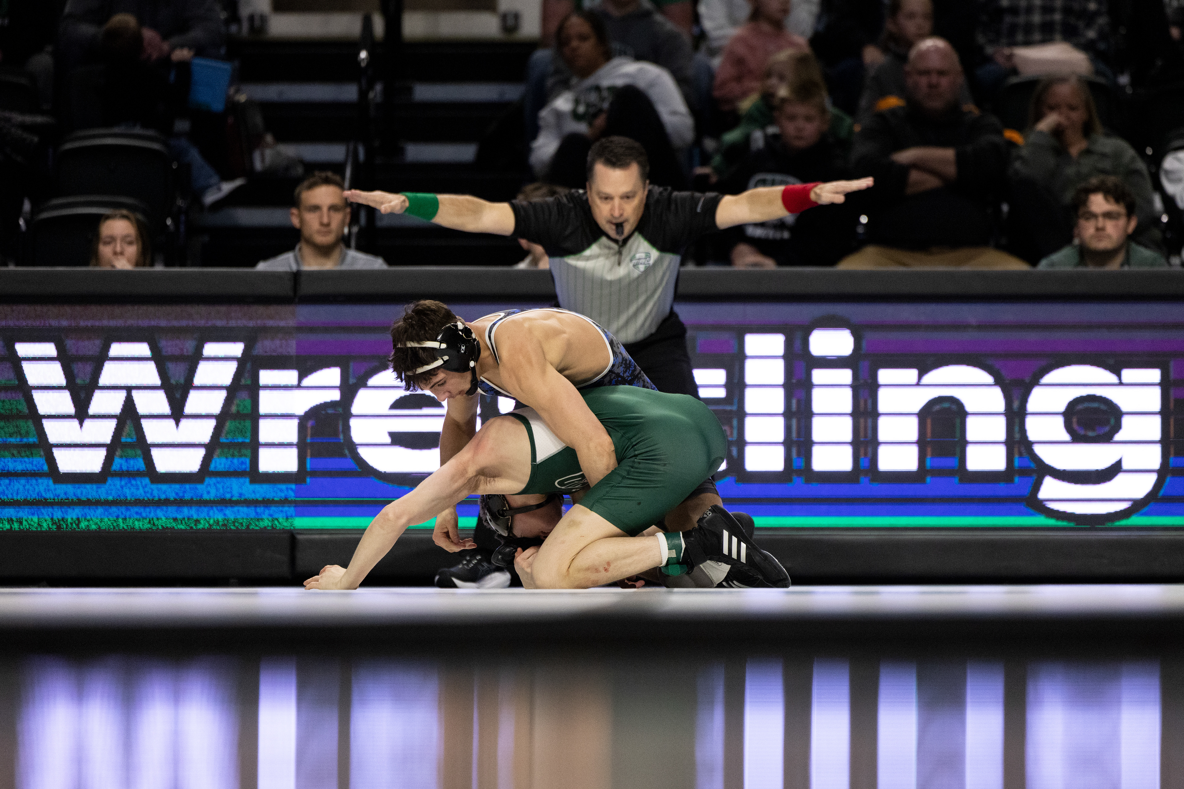 Ohio University guard, Shereef Mitchell (4), fakes a layup and passes the ball around a Miami University player at the Convocation Center in Athens, Ohio, Feb. 3, 2024.