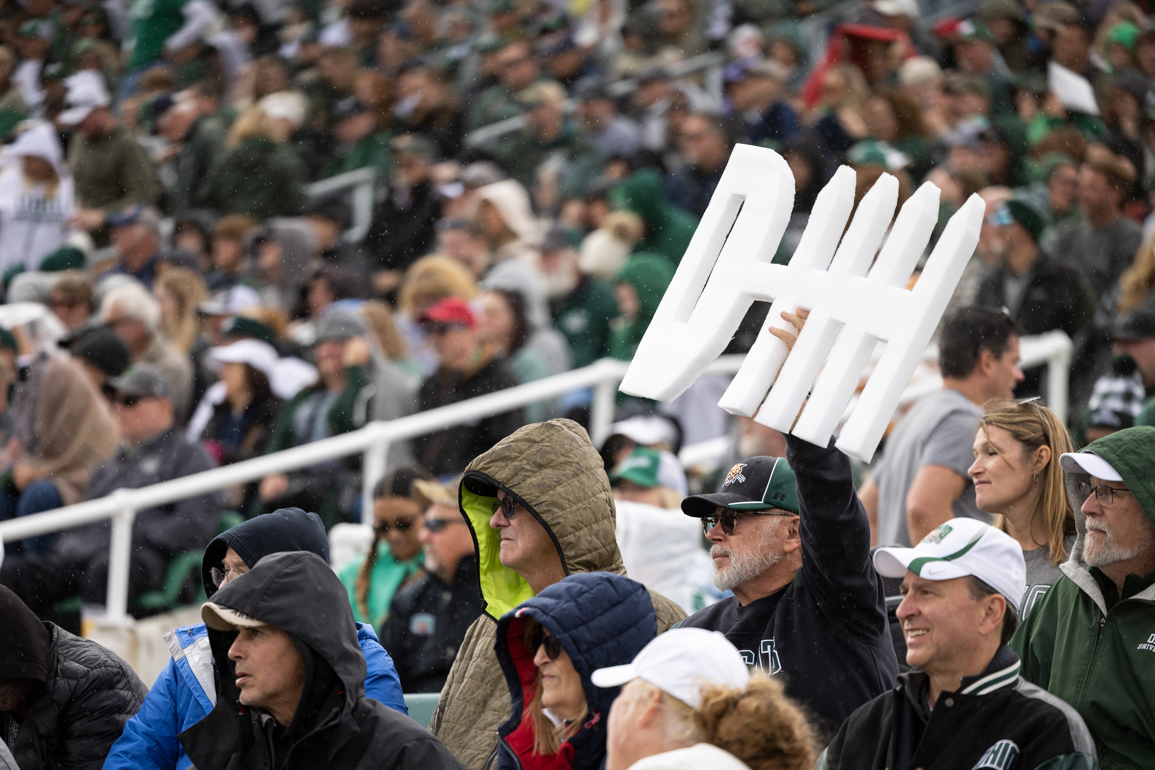 An Ohio University fan holds up a defense sign during the game against Kent State at Peden Stadium in Athens, Ohio, Oct. 7, 2023.