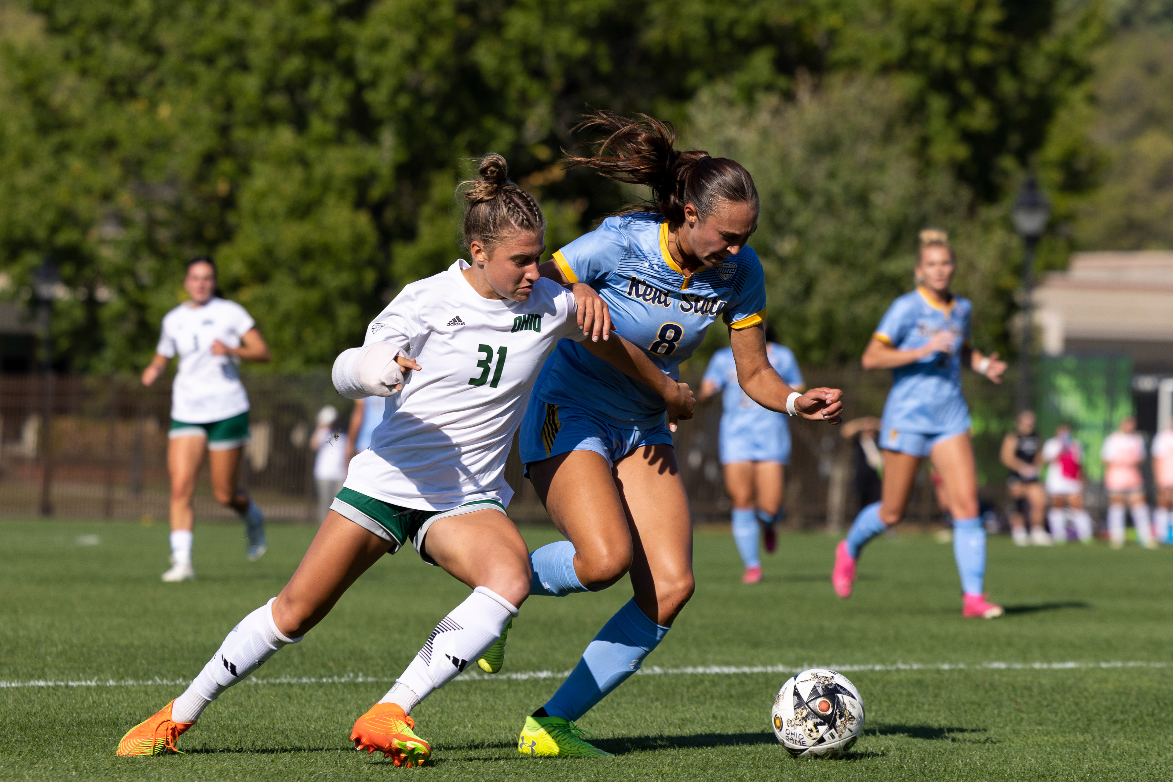 Ohio University first-year, Ellie Greenwall (31), fights off a Kent State player for the ball at Chessa Field in Athens, Ohio, Sept. 21, 2023.