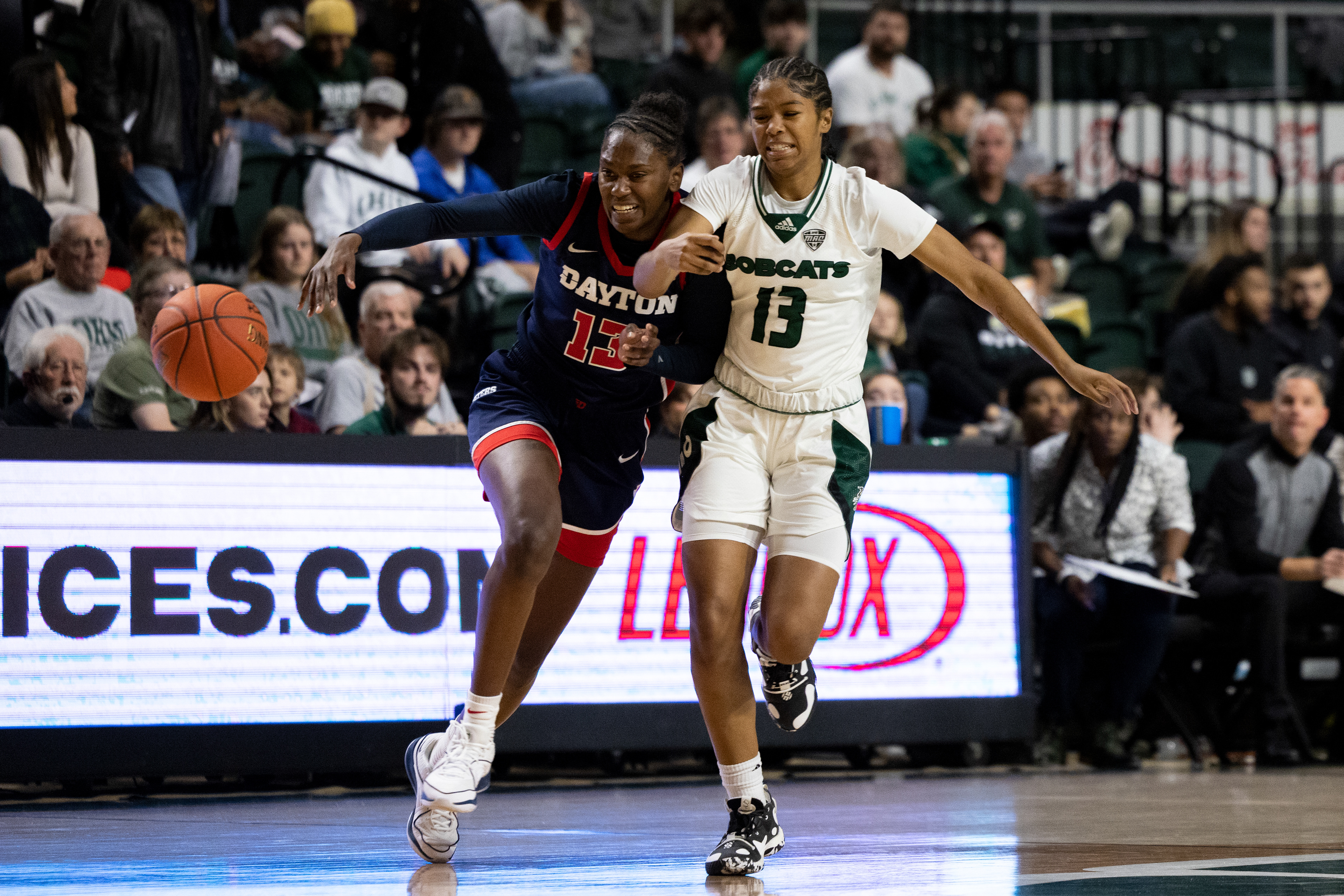 Ohio University guard Monica Williams (13) races a Dayton player to steal the ball at the Convocation Center in Athens, Ohio, Nov. 16, 2023.